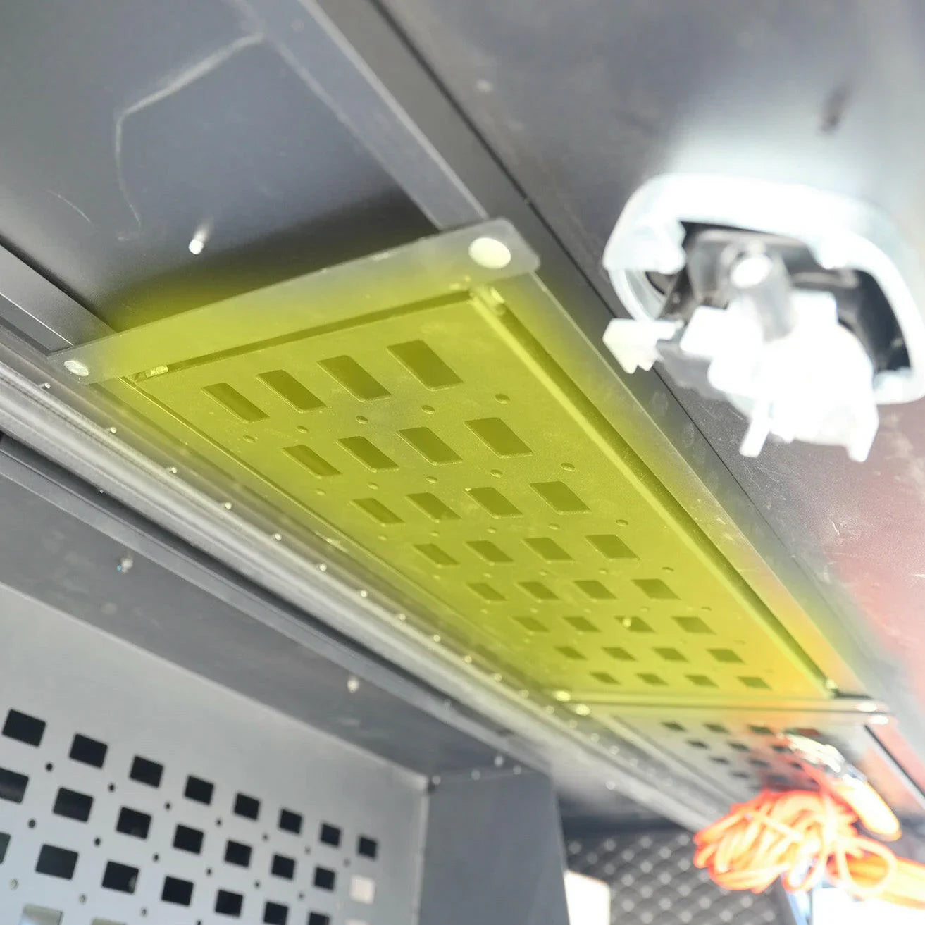 Overland vehicle MOLLE panel mounted inside cargo area with wiring visible