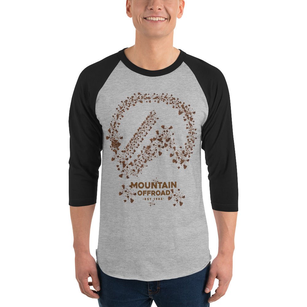 Man wearing grey and black raglan shirt with Mountain Offroad graphic, outdoor adventure style