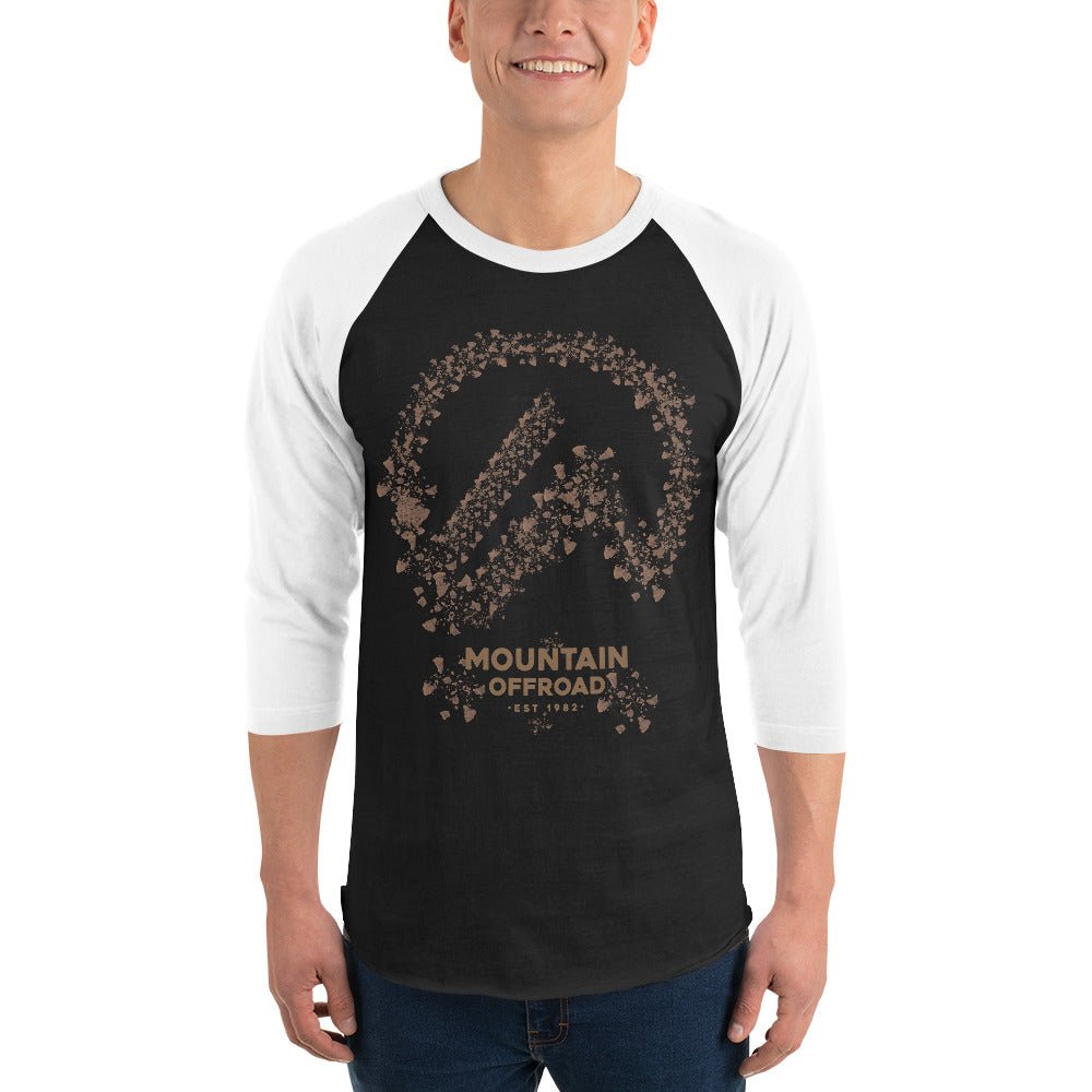 Man wearing black and white raglan shirt with Mountain Offroad graphic and outdoor adventure text