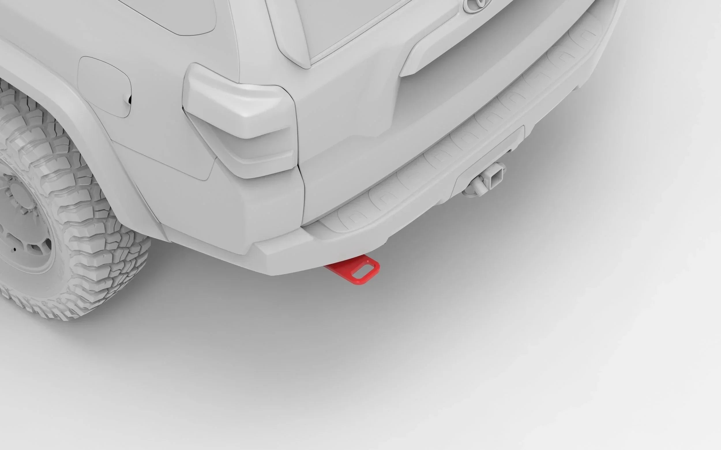 Rear view of off-road SUV with red rear recovery point and rugged all-terrain tire