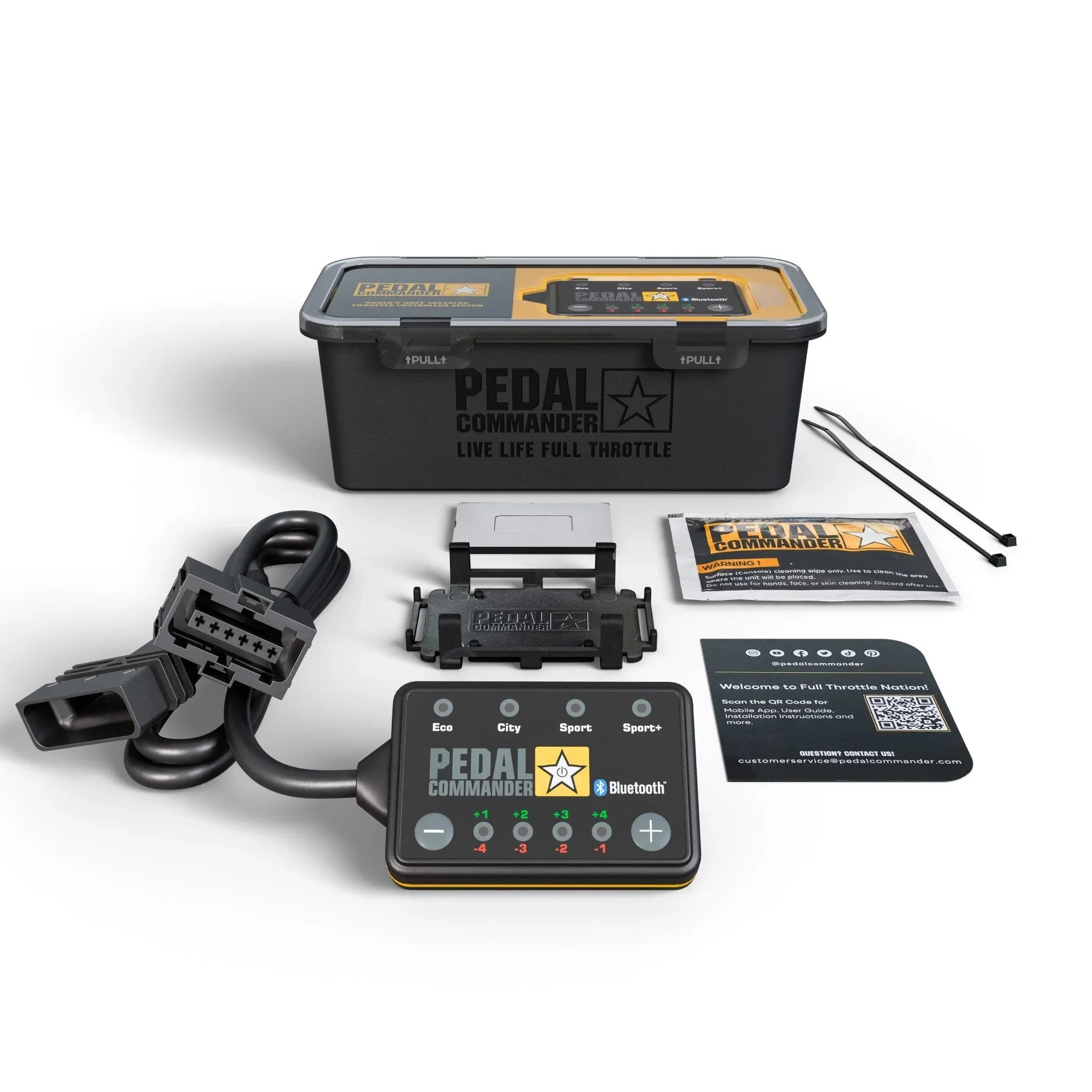 Pedal Commander throttle response controller kit with cables, mounts, zip ties, instructions, and box