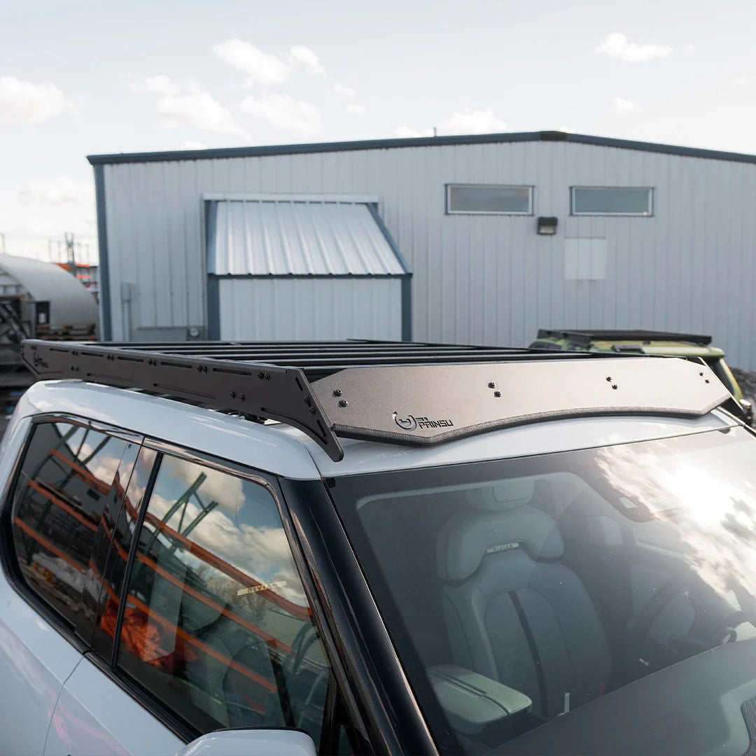 Closeup of black roof rack on white SUV, ideal for overlanding and expedition gear transport