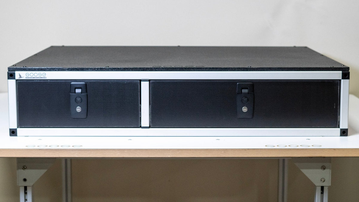 Goose Gear side-by-side drawer module, black carpeted top with aluminum frame, front view with both drawers closed