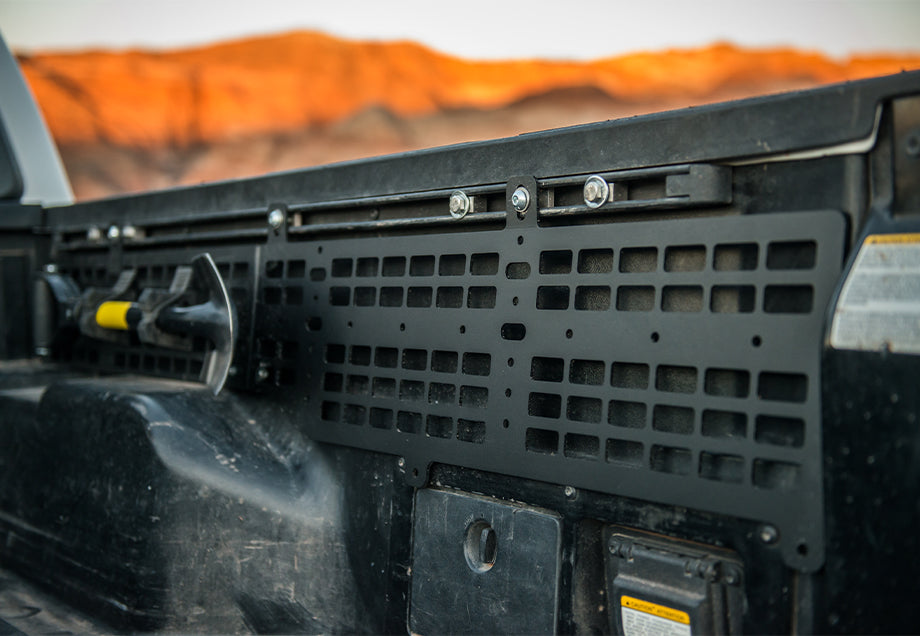 Toyota Tacoma bed molle panel with mounted accessory in desert setting