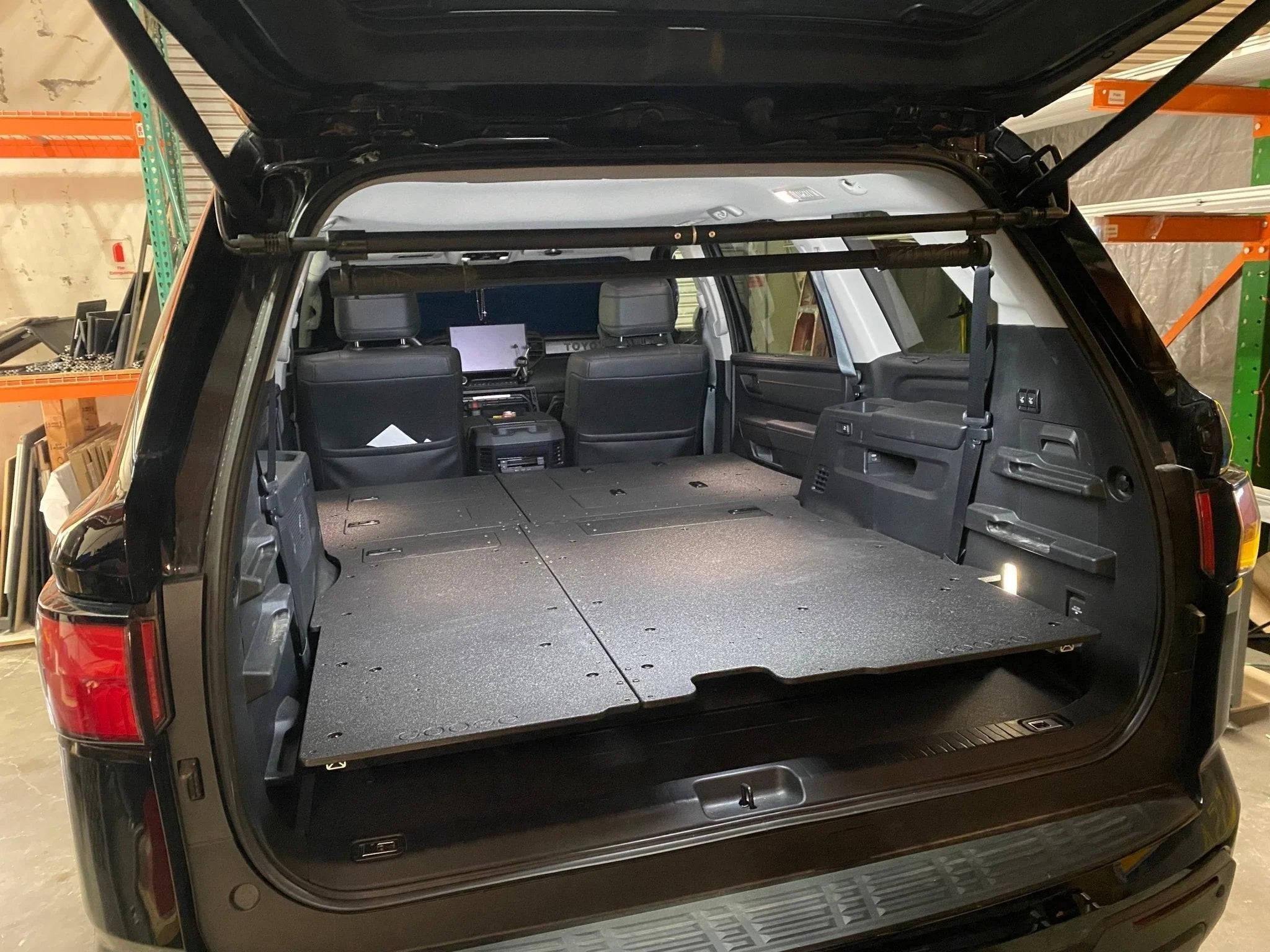 Toyota Sequoia 3rd gen cargo area with seat delete plate system for stealth sleeping