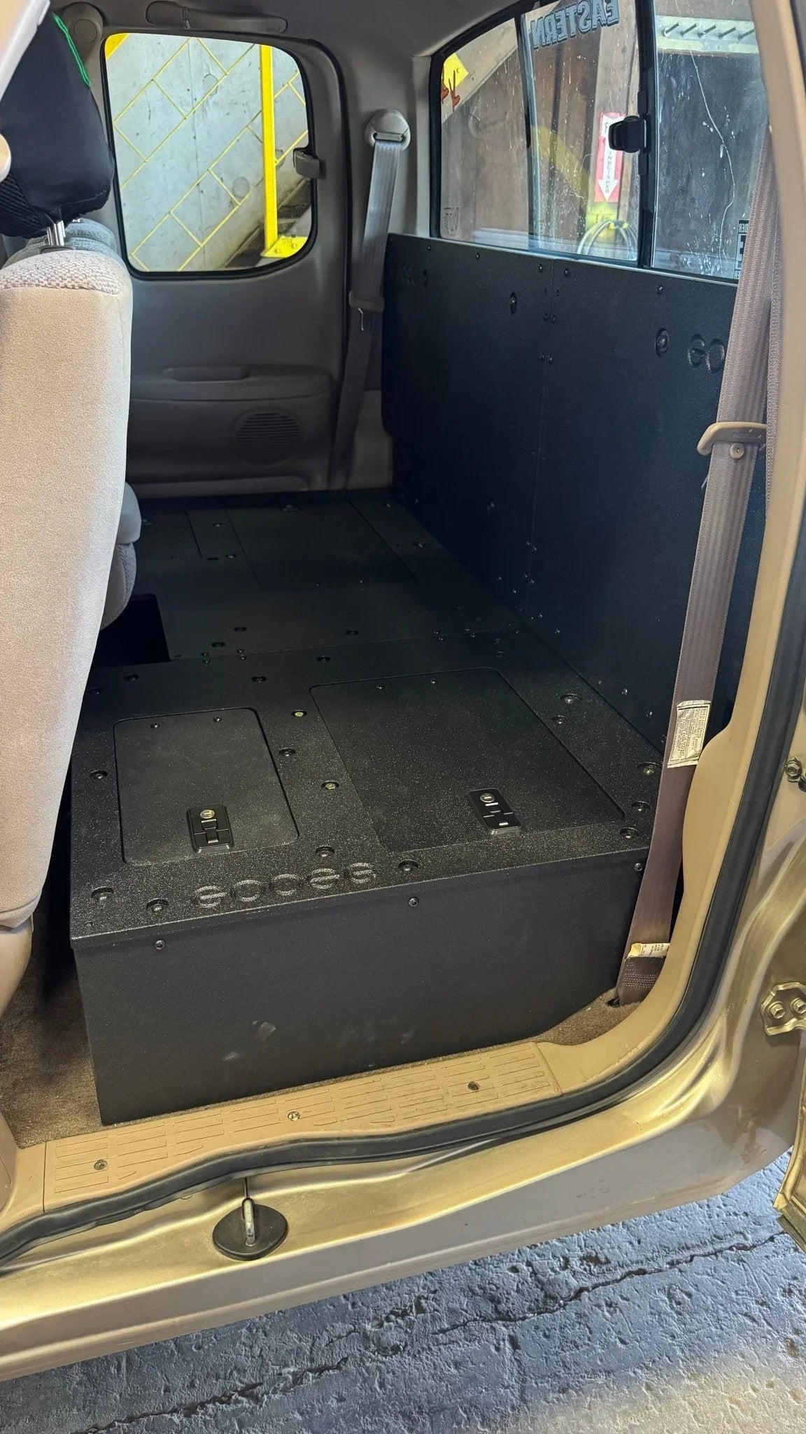 Toyota Tundra Access Cab seat delete plate system installed in second row for storage
