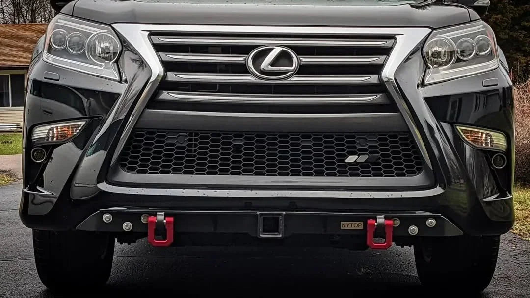 Front view of Lexus SUV with off-road bumper, two red recovery points, and hitch receiver