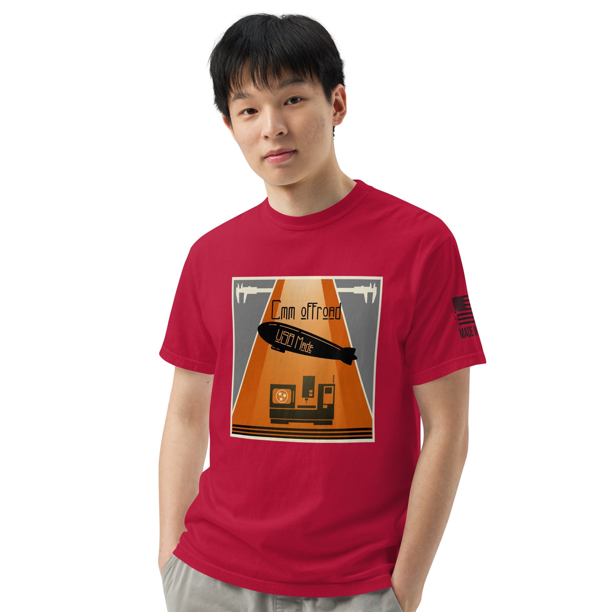 Man wearing red unisex heavyweight t-shirt with off-road USA themed graphic print