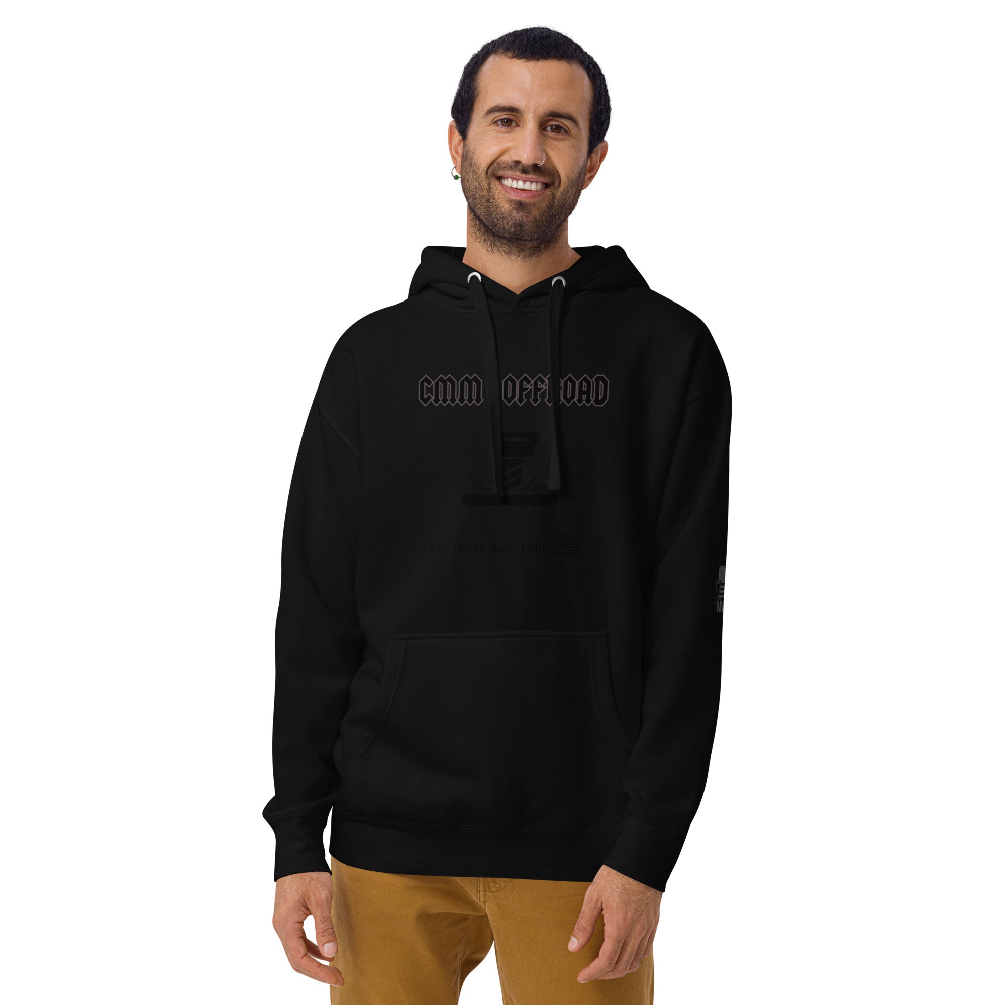 Smiling man wearing black unisex off-road graphic hoodie with front pocket