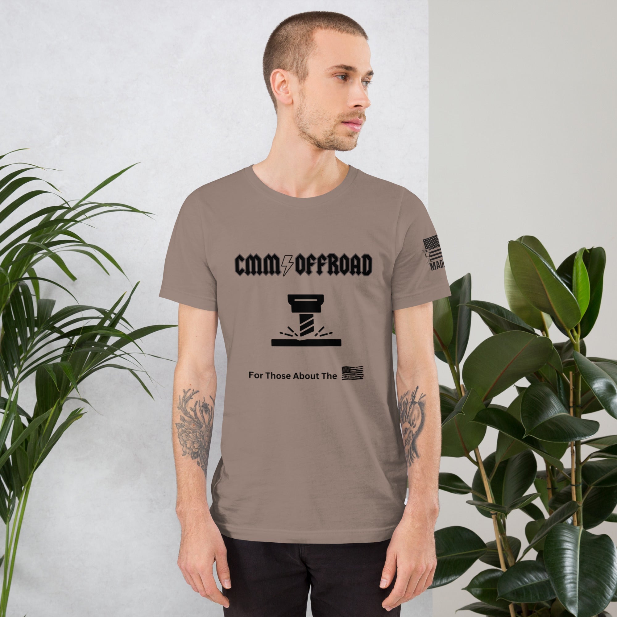 Man wearing pebble-colored unisex CMM Offroad t-shirt with off-road graphic design