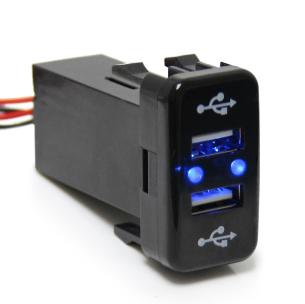 Dual USB car charger port with blue LED lights, compatible with overlanding vehicles
