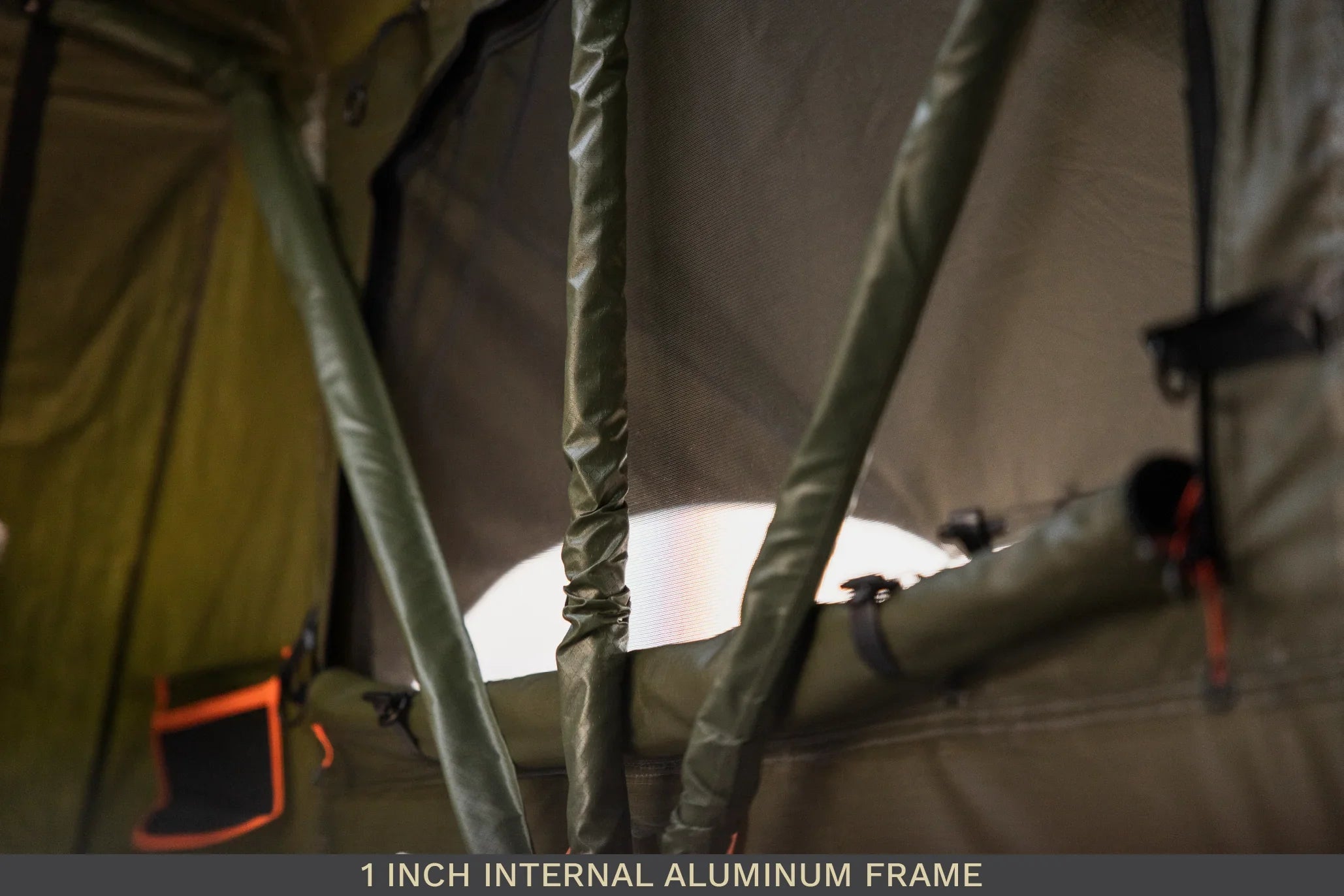 Detail of 1 inch internal aluminum frame inside expedition roof top tent with green fabric