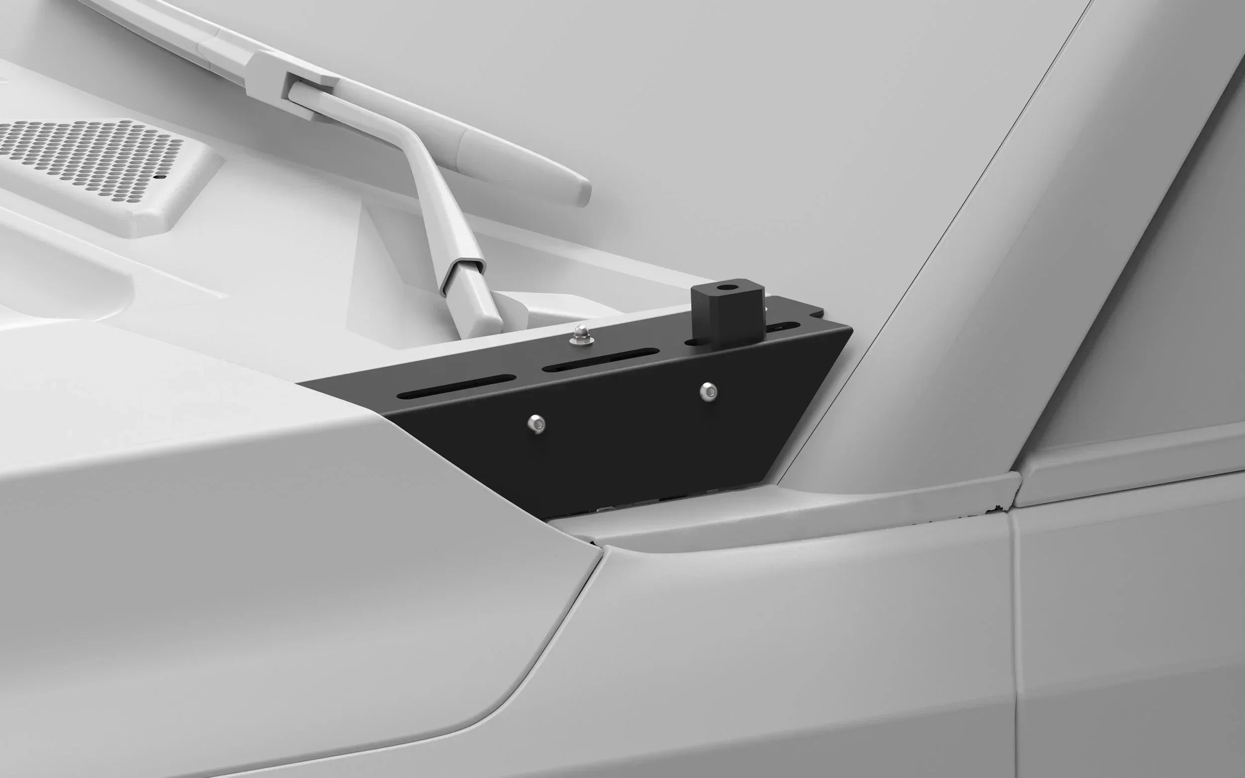 Close-up of a black hood mount bracket installed near a vehicle windshield wiper