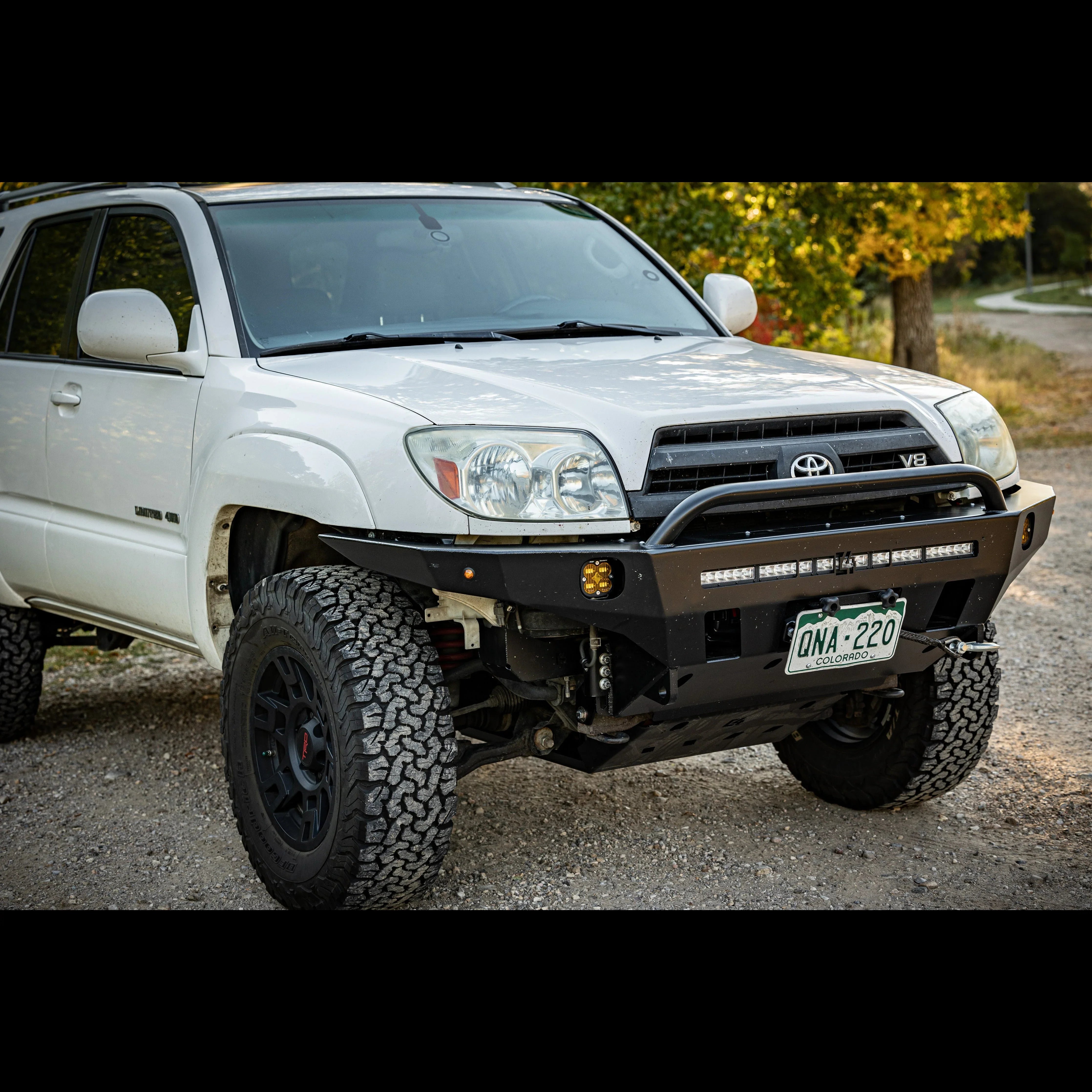 Toyota 4Runner with off-road front bumper, lifted suspension, and rugged all-terrain tires