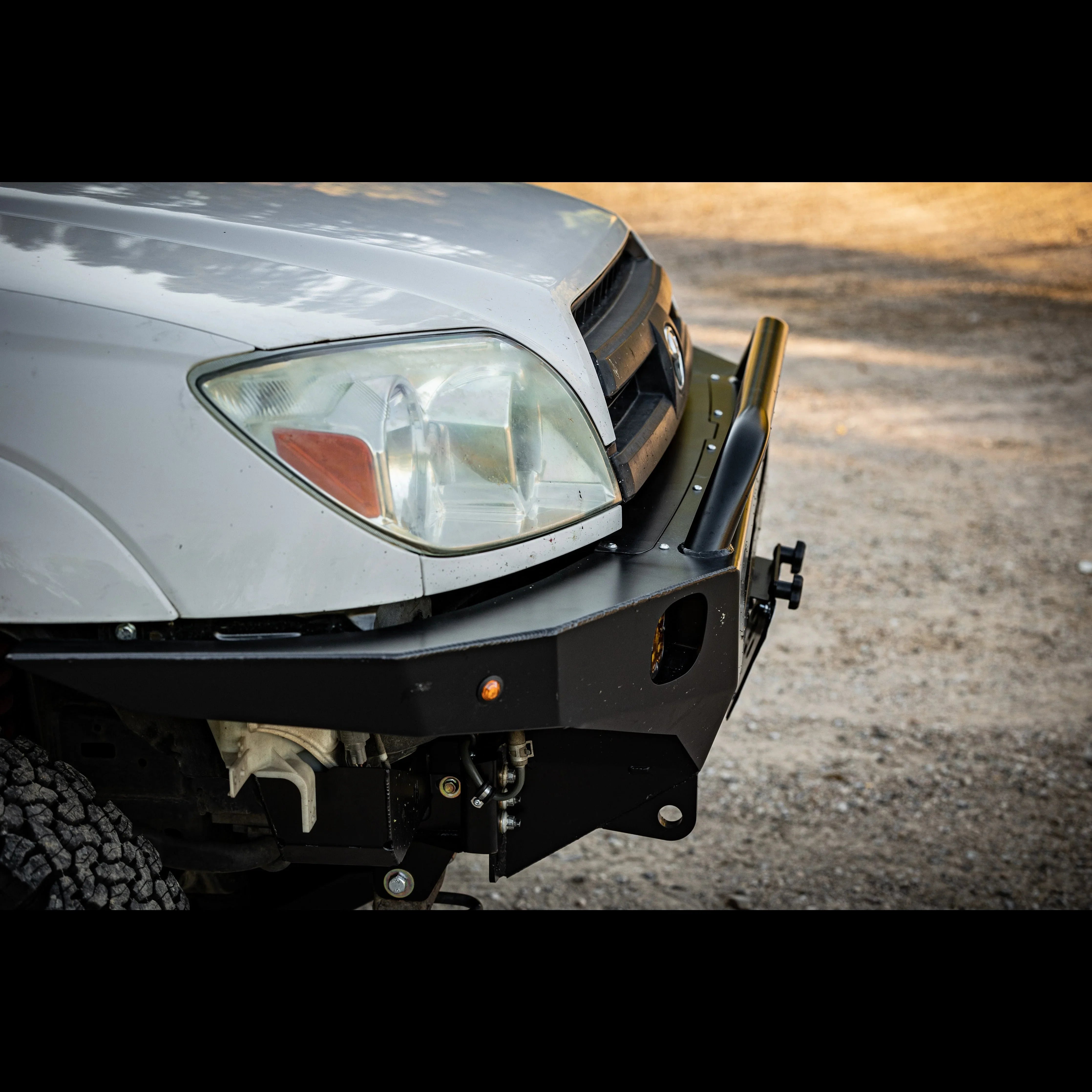 Heavy-duty steel front bumper on Toyota Tacoma for off-road and overlanding