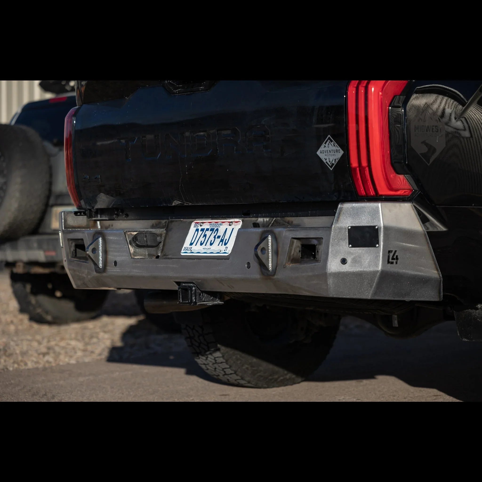 Heavy-duty aftermarket steel rear bumper on Toyota Tundra, off-road accessory.