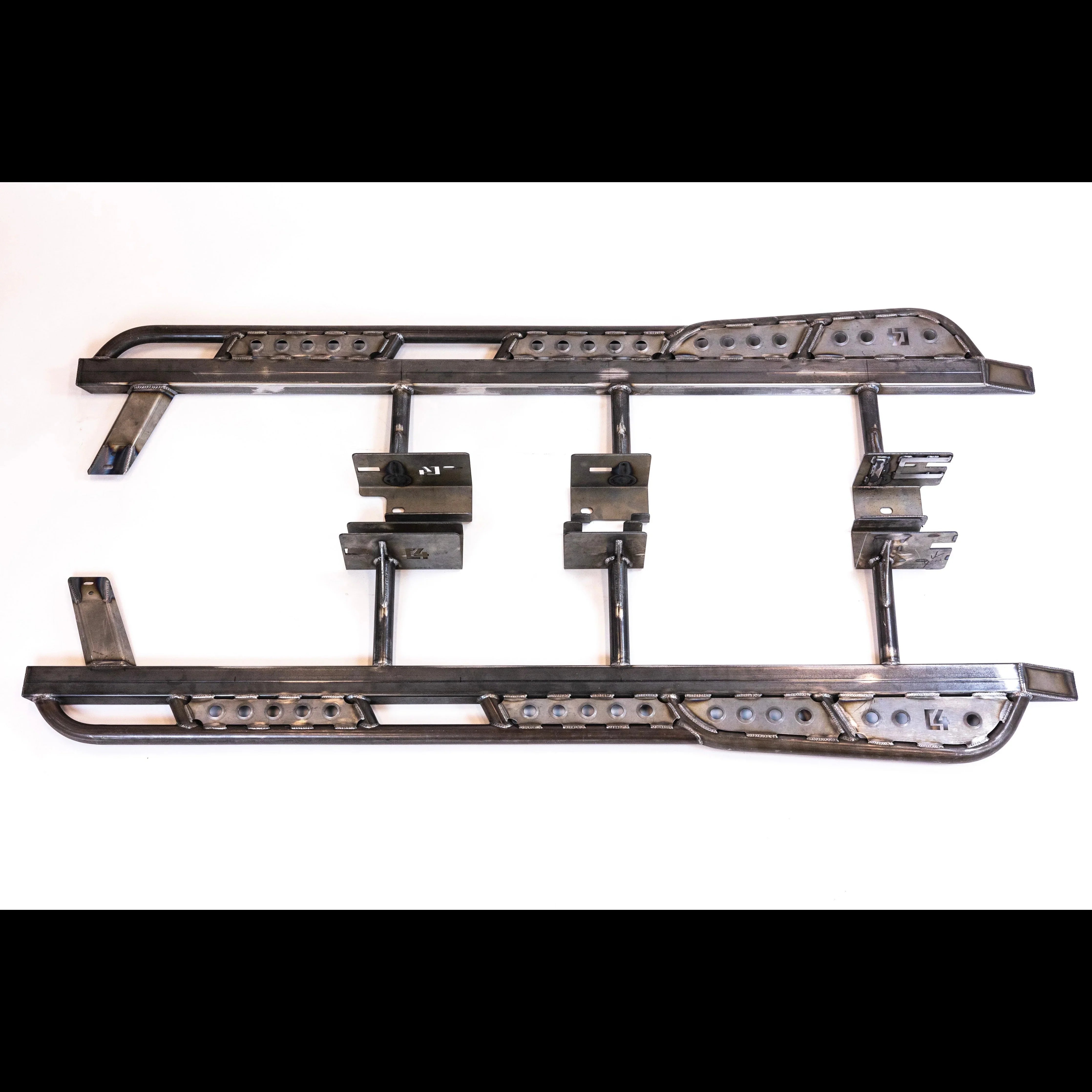 Steel rock slider for off-road vehicle, mounting brackets visible, white background