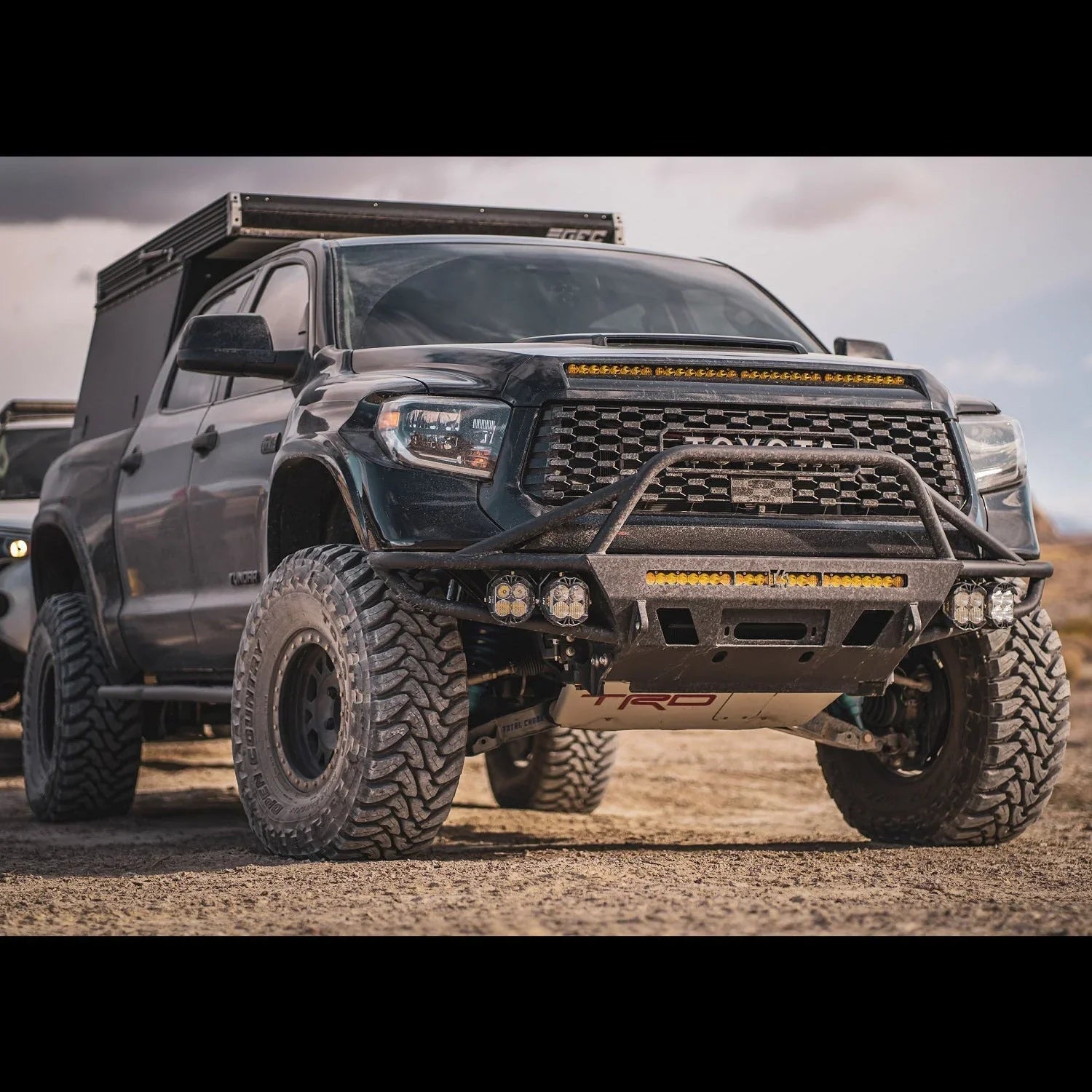 Toyota Tundra overland truck with off-road tires, custom bumper, LED light bars, roof rack