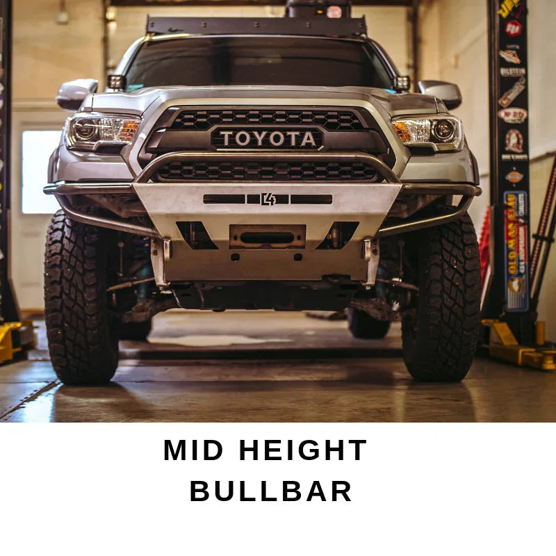 Toyota Tacoma with mid height bullbar for off-road protection in garage