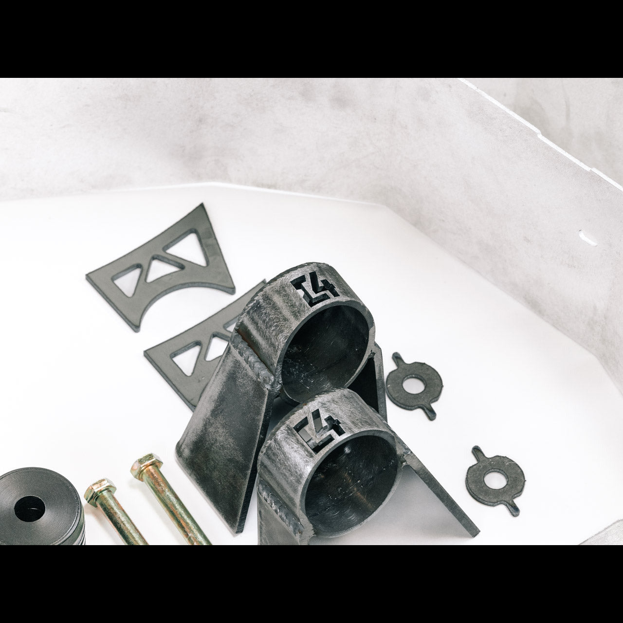 Steel off-road suspension brackets and mounting hardware for Toyota Tacoma or 4Runner