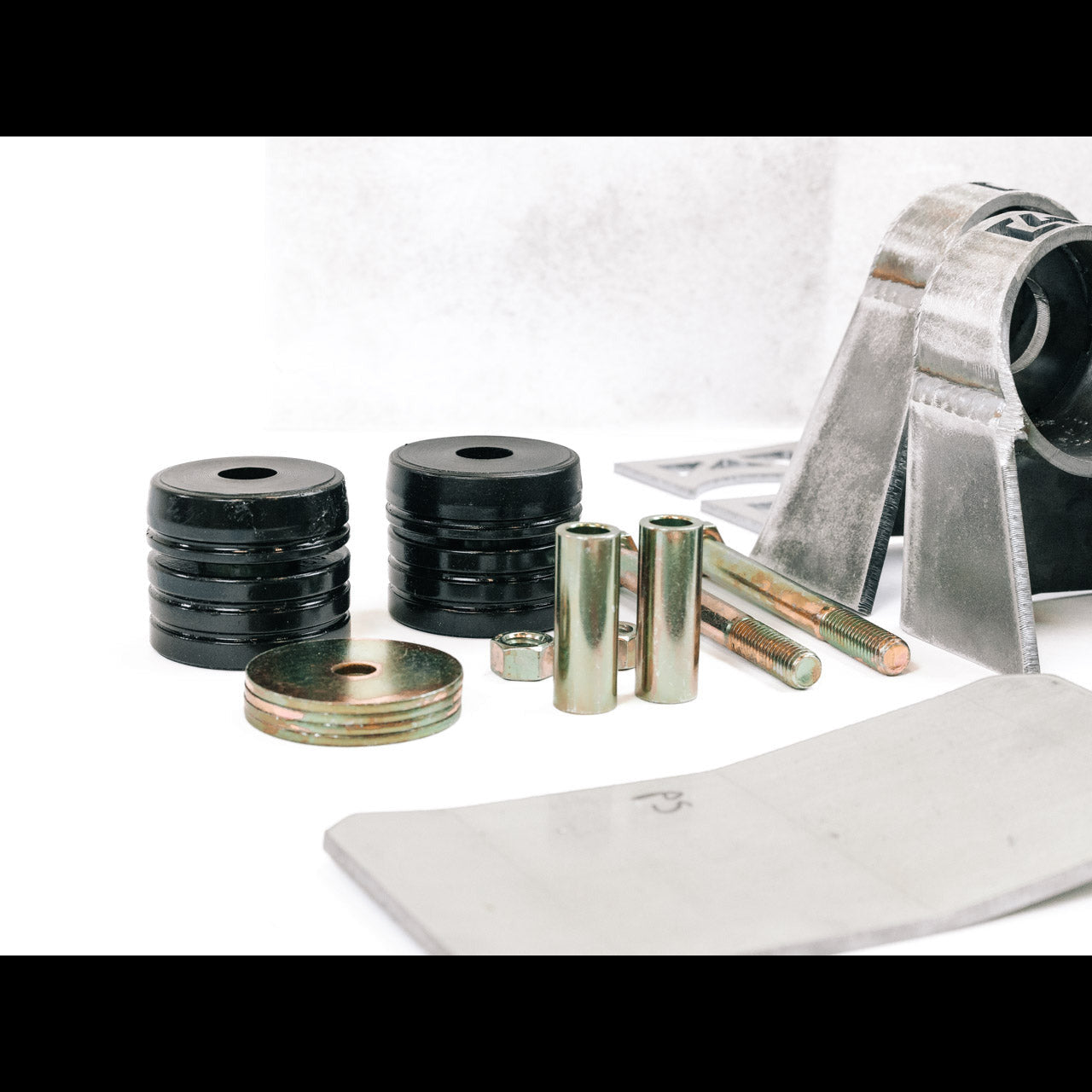 Suspension lift kit hardware and components for off-road vehicle modification.