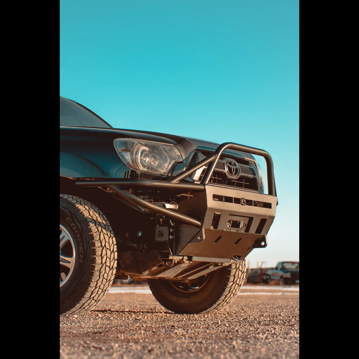 Heavy-duty steel front bumper on Toyota Tacoma for off-road and overlanding vehicles