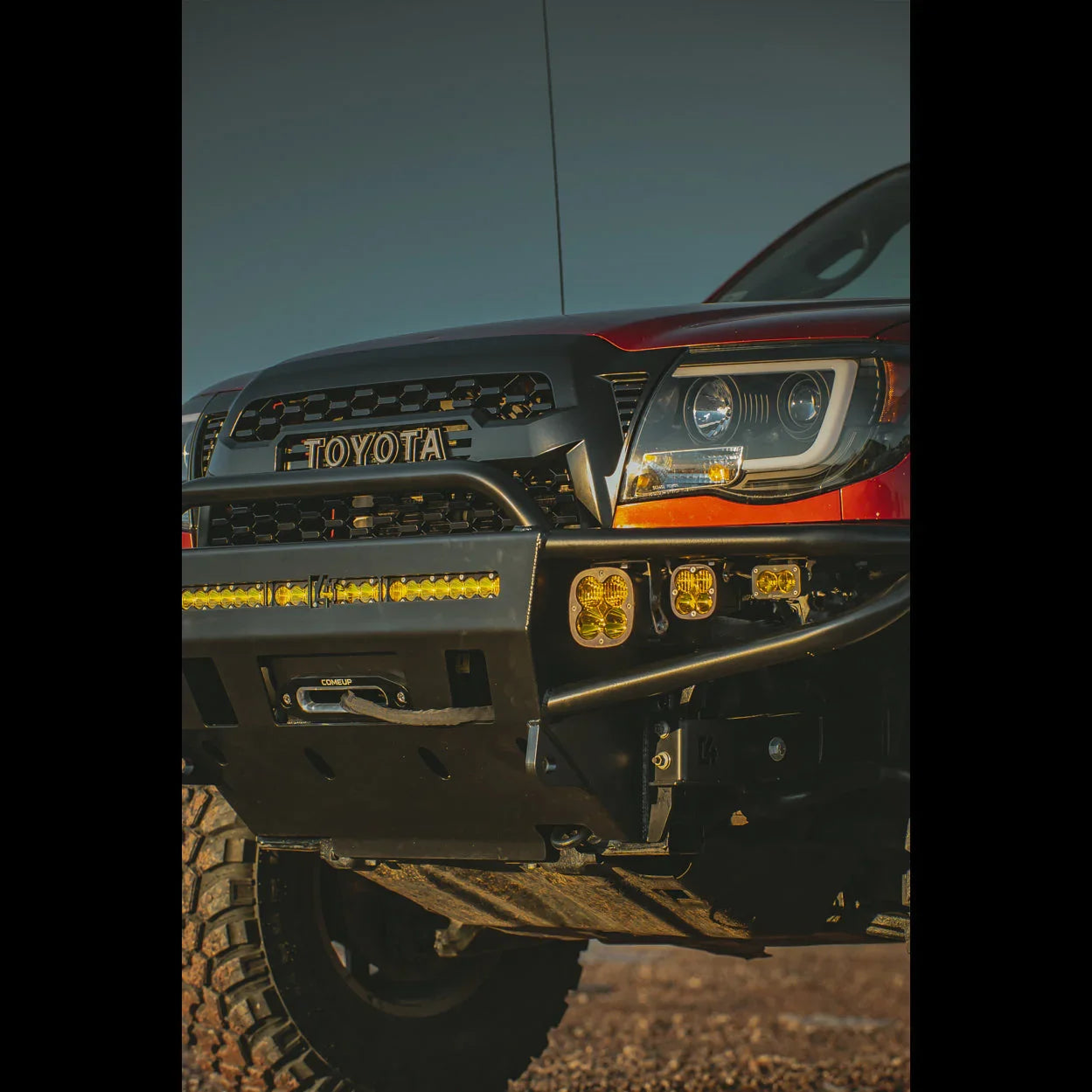 Toyota Tacoma front bumper with off-road lights and rugged aftermarket grille