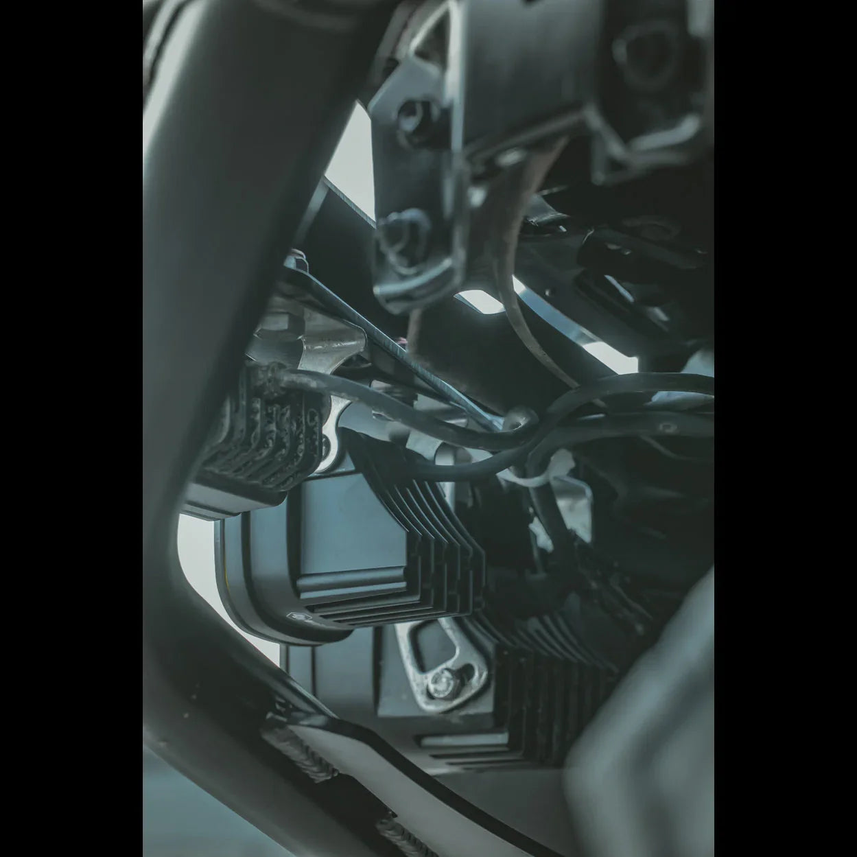 Close-up of Toyota Tacoma off-road accessory mount and wiring under vehicle