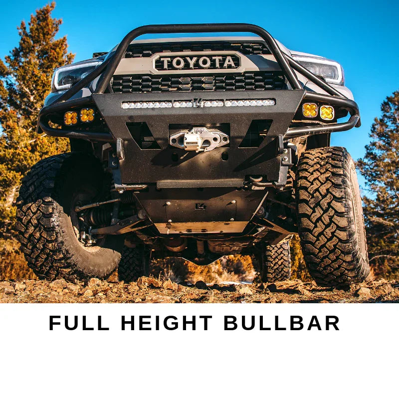 Toyota truck with full height bull bar, off-road tires, and aftermarket bumper