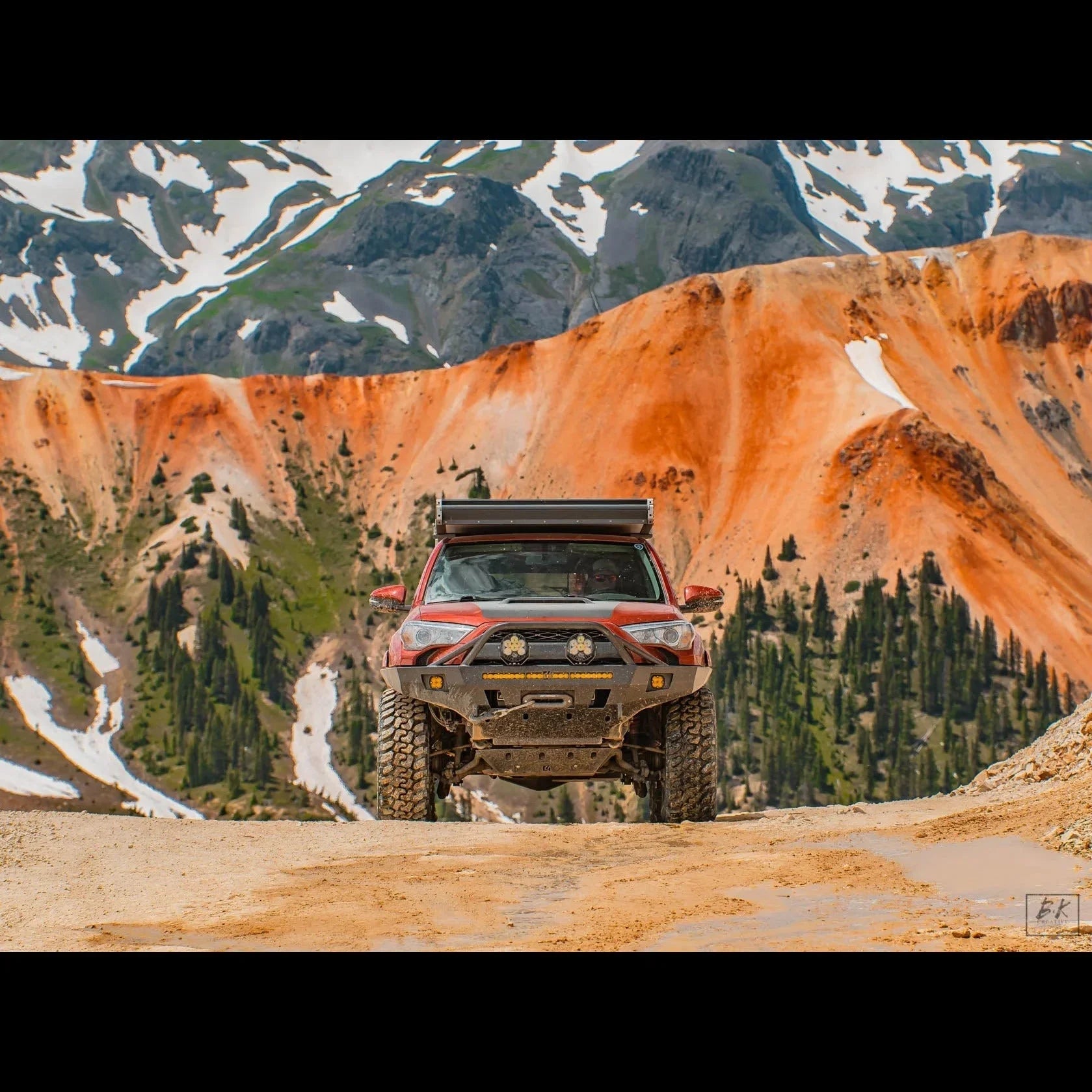 Toyota 4Runner with off-road front bumper in rugged mountain landscape, overlanding setup