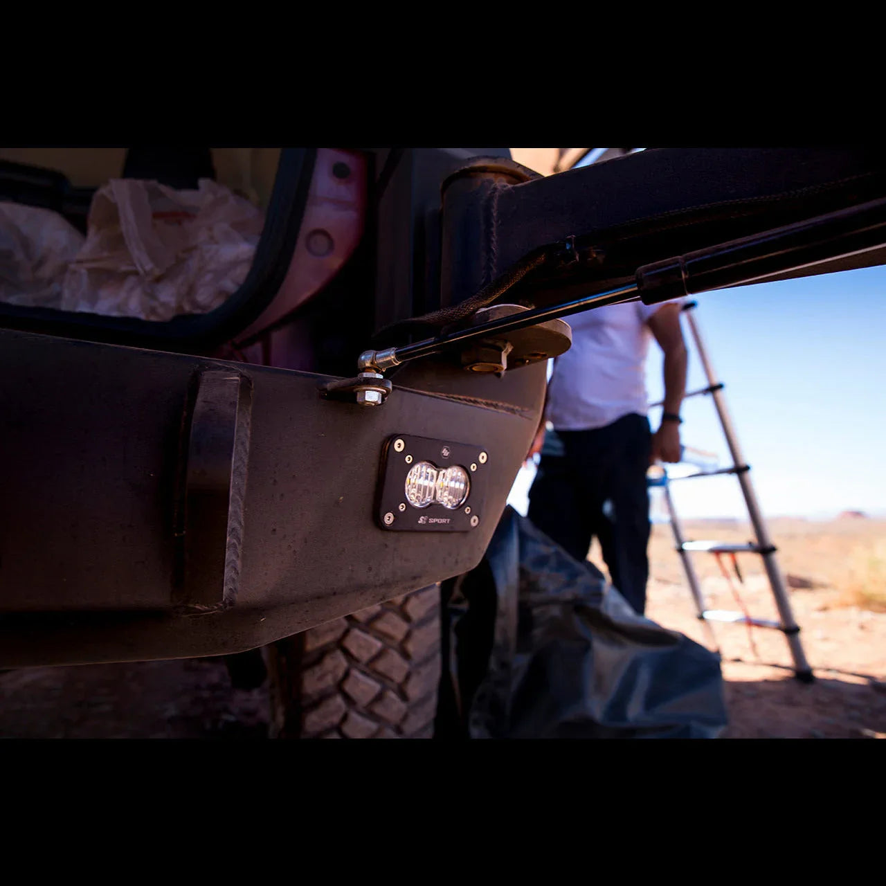Toyota 4Runner rear bumper with off-road LED light and swing-out arm, outdoor setting
