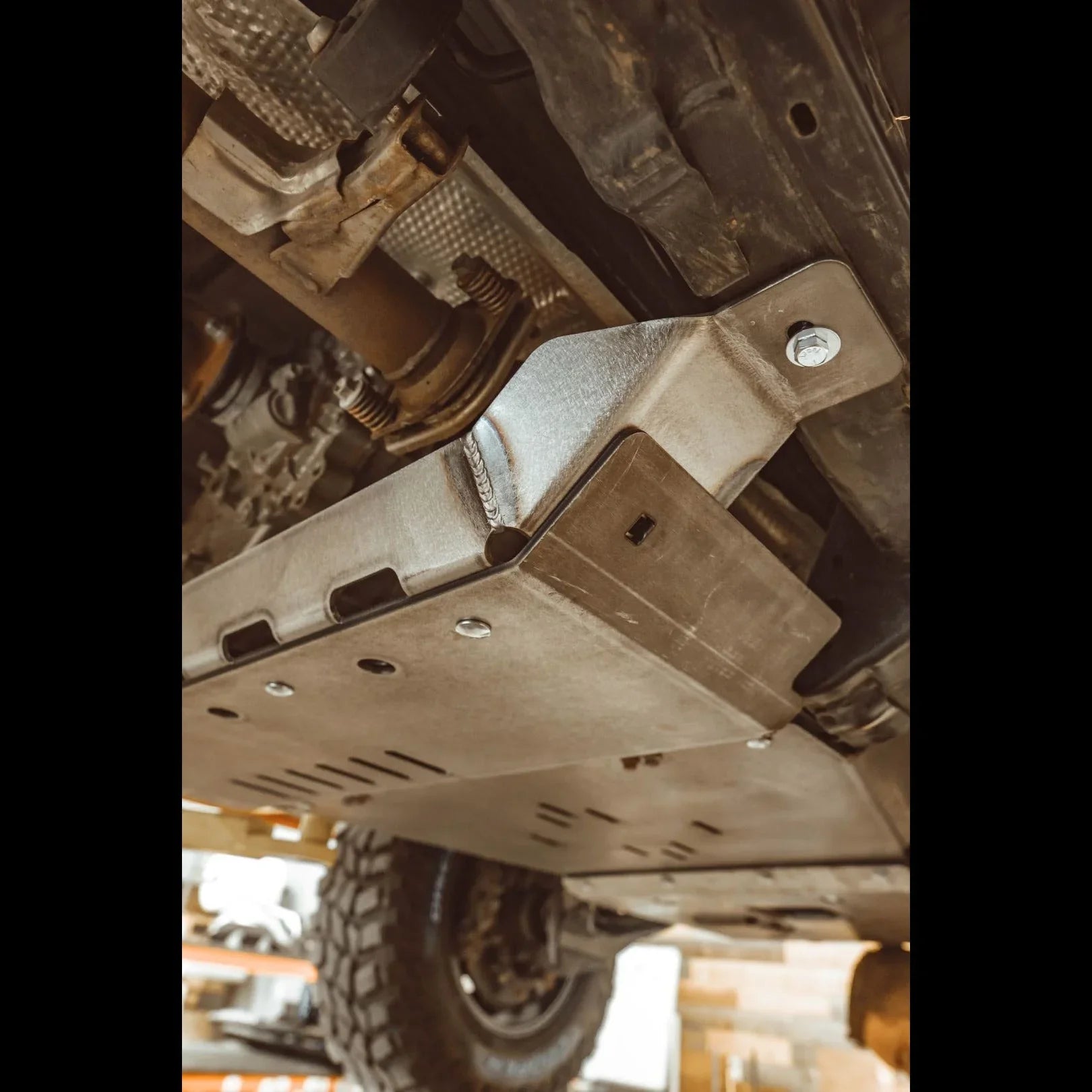 Metal rear skid plate installed under Toyota 4Runner 5th Gen for off-road protection