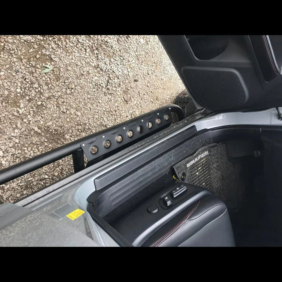 Rock sliders installed on a Toyota 4Runner for off-road protection, view from open door