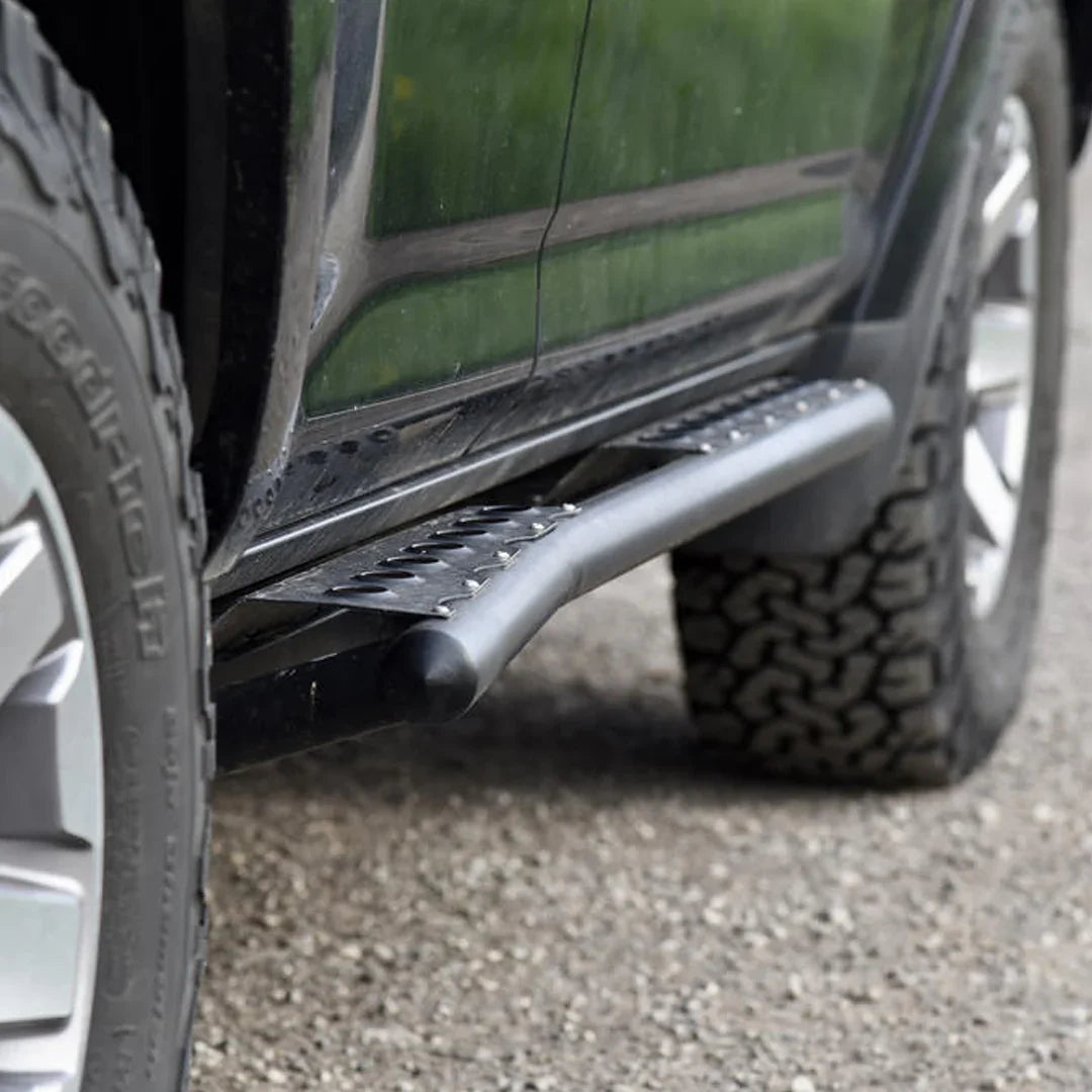 Toyota 4Runner 5th gen rock slider side step mounted, off-road tire visible
