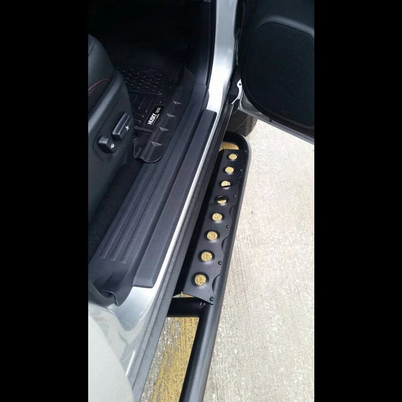 Toyota 4Runner 5th Gen rock slider step accessory mounted beside open vehicle door