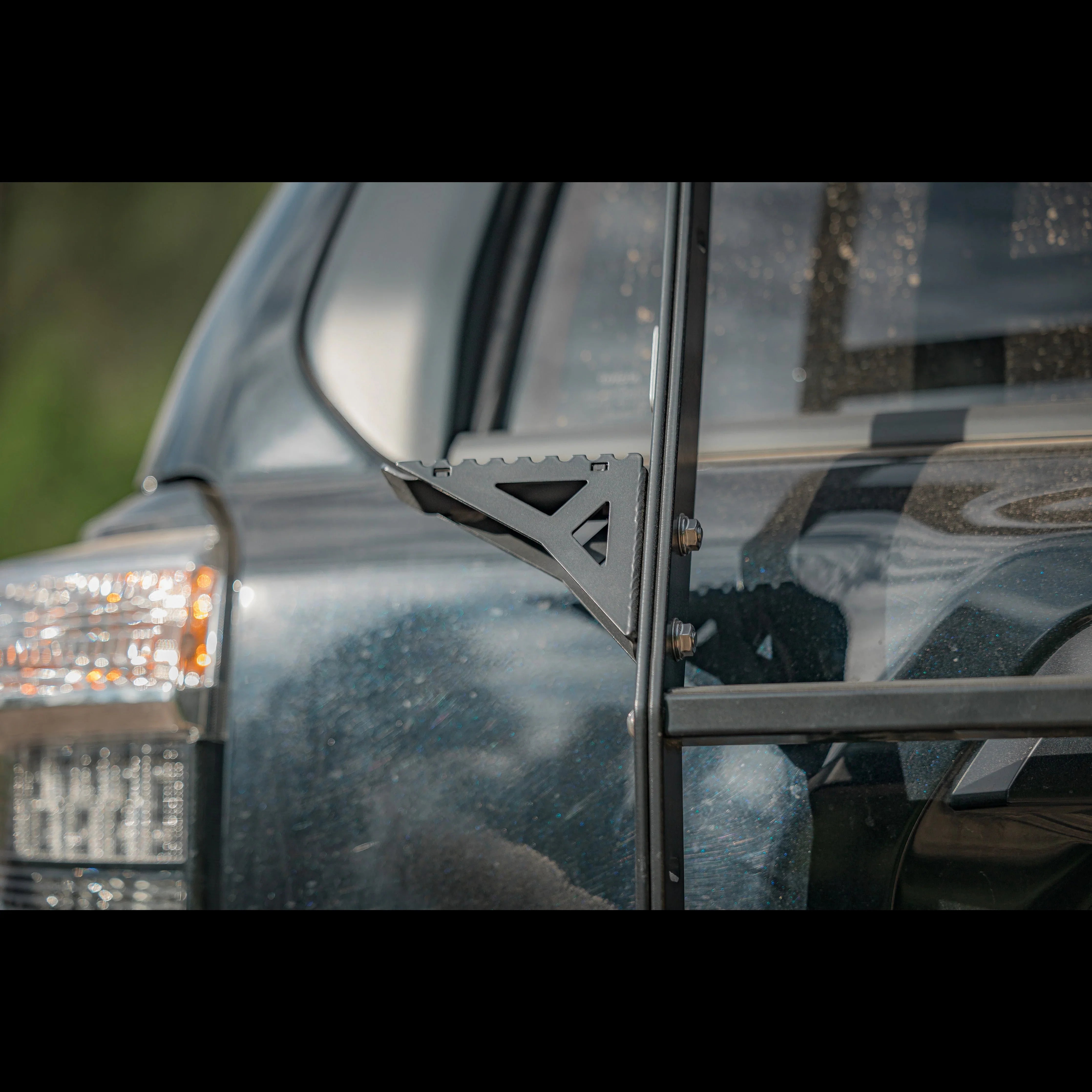 Close-up of summit hatch ladder mounted on rear of Toyota 4Runner for overlanding