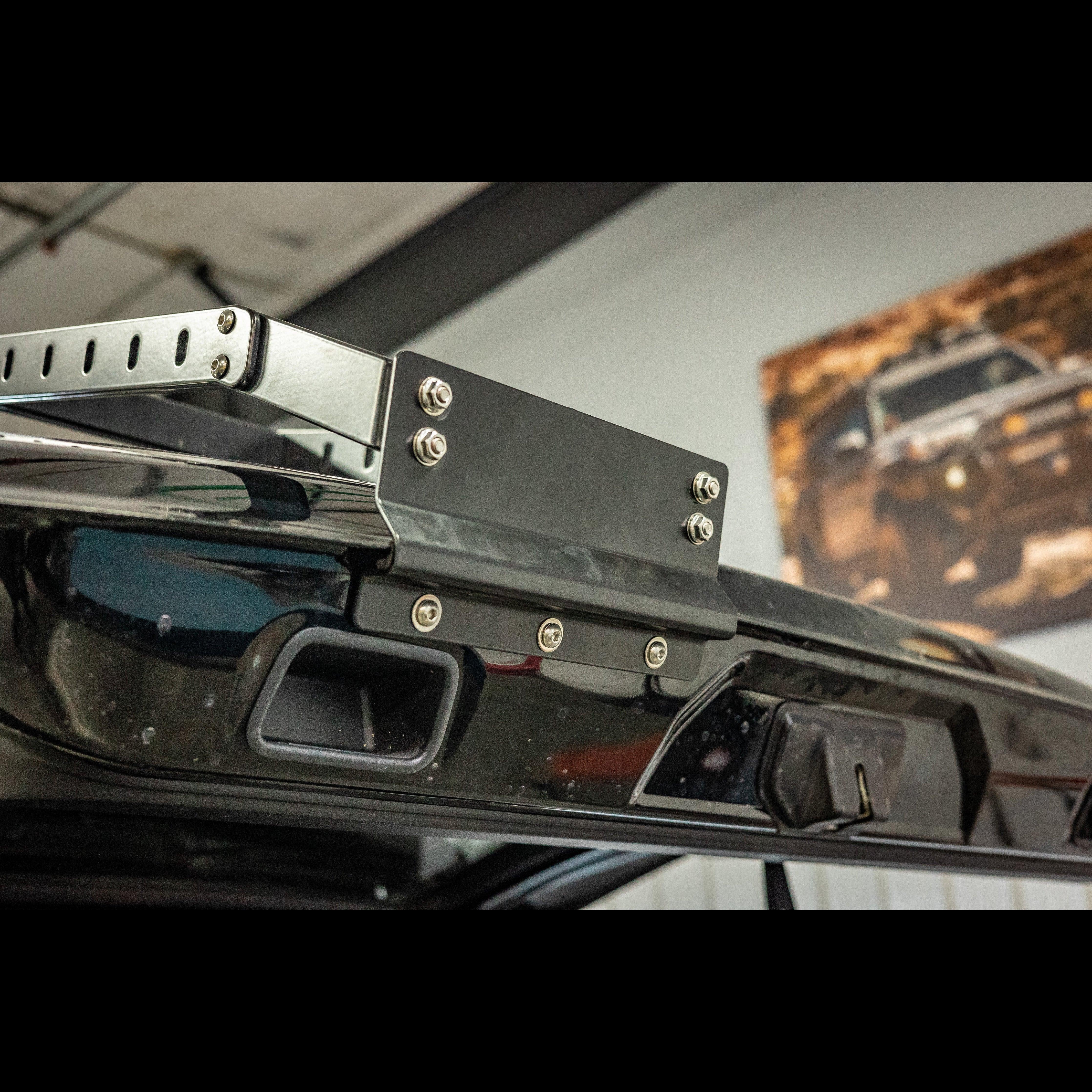 Toyota 4Runner summit hatch ladder bracket installed on rear door, close-up view