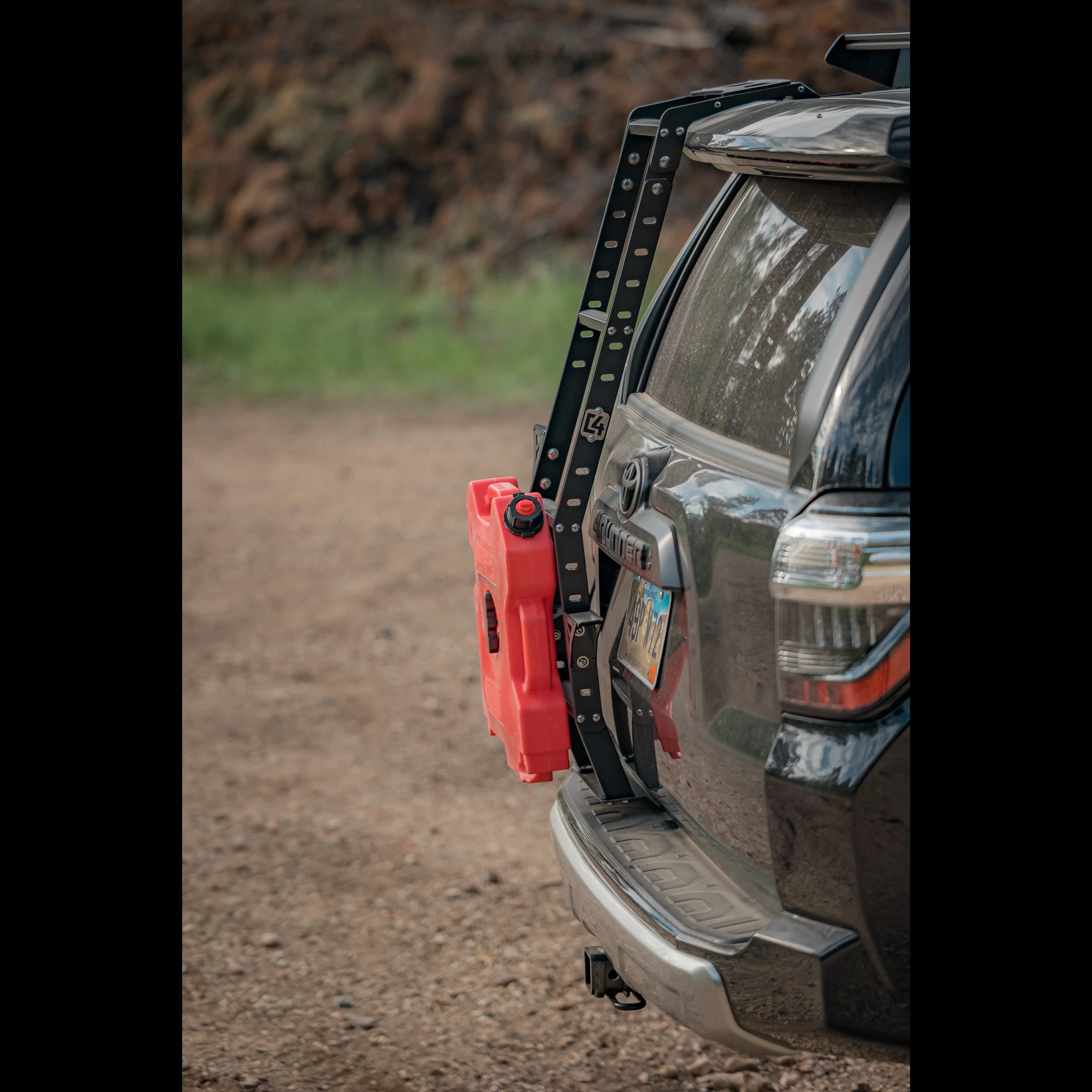 Toyota 4Runner with rear hatch ladder and red fuel can for overlanding gear