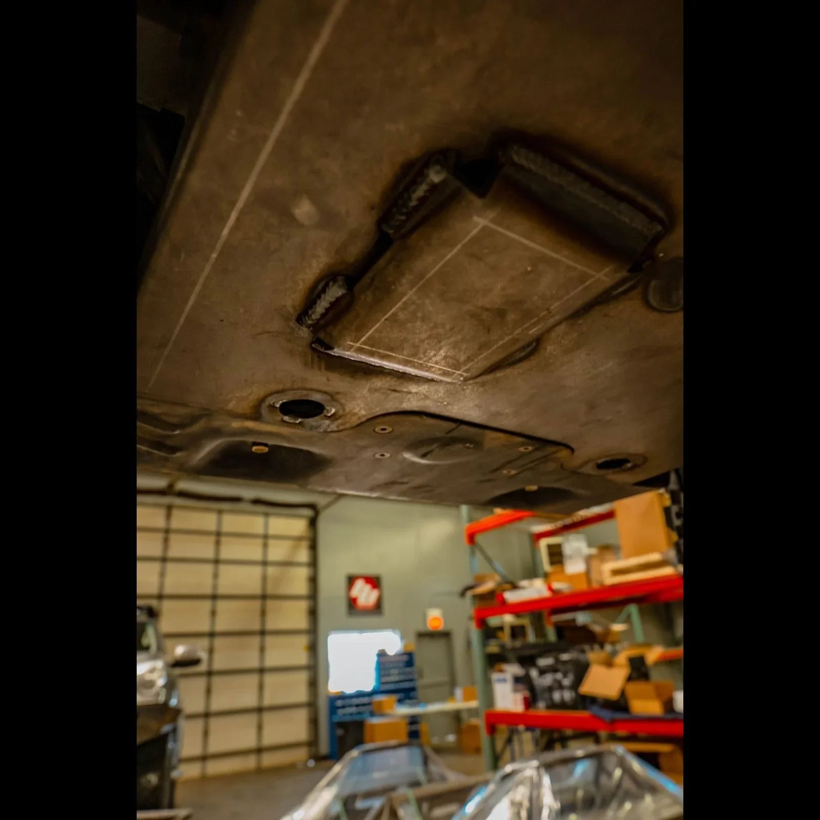 Toyota 4Runner TRD Pro integration skid plate underside in garage setting