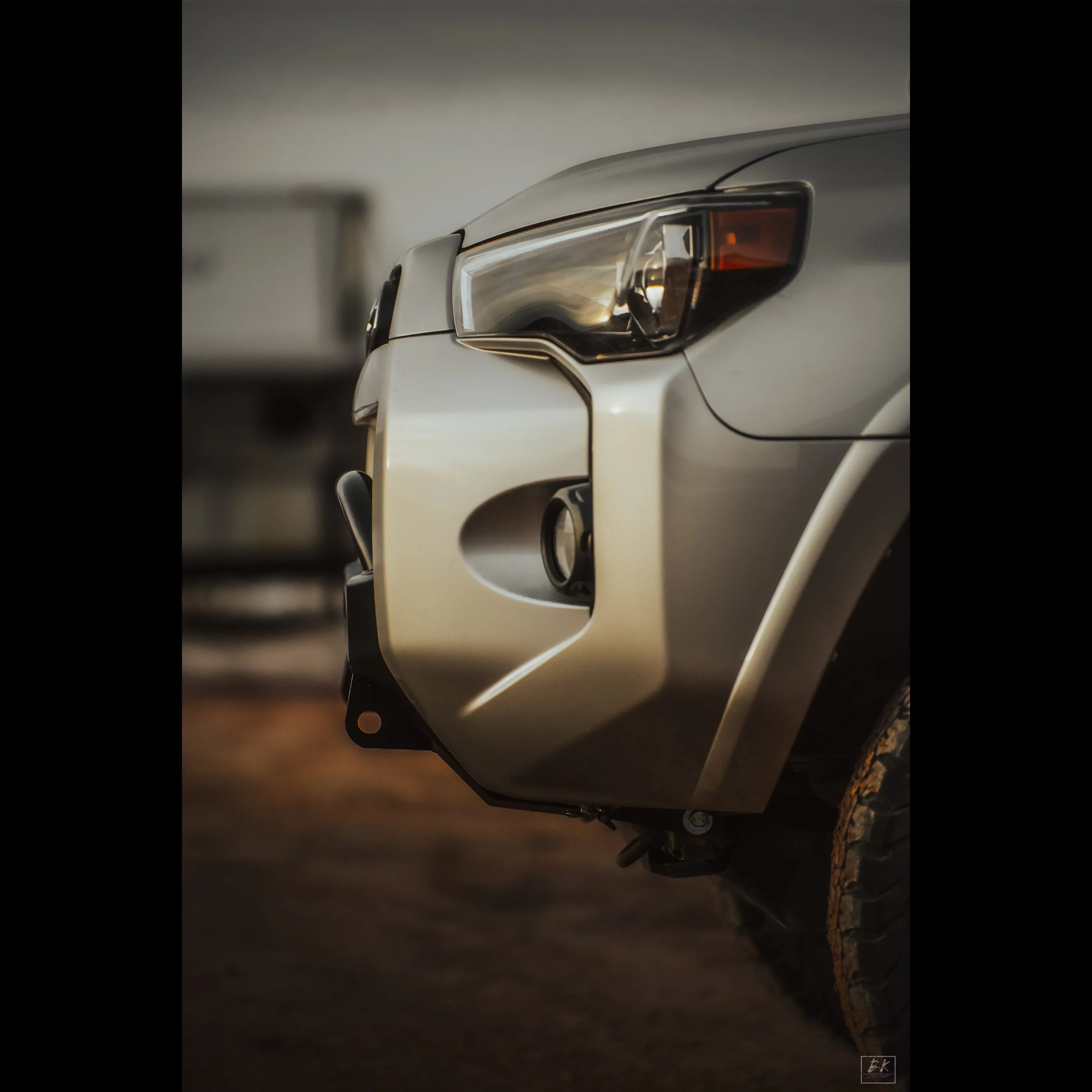 Close-up of Toyota 4Runner front bumper with off-road armor and rugged headlight detailing