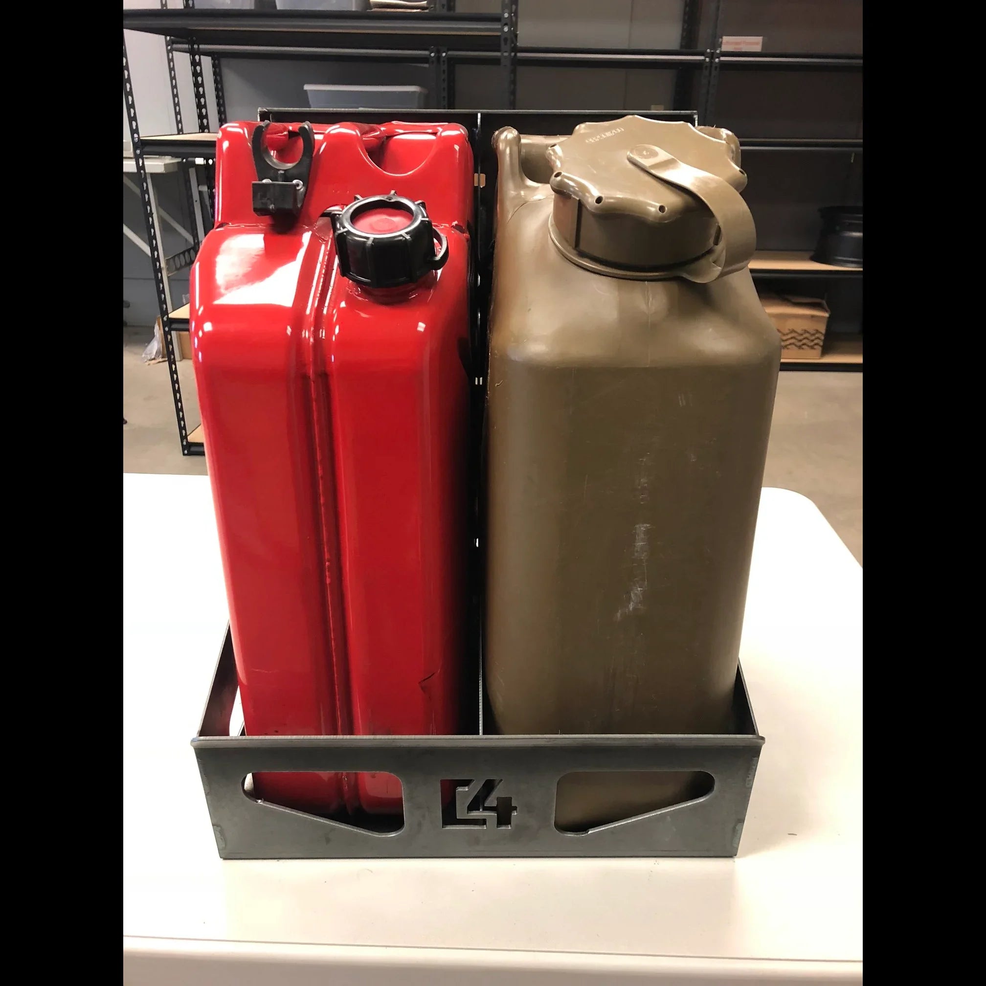 Red and tan jerry cans in a metal carrier for overlanding vehicle storage