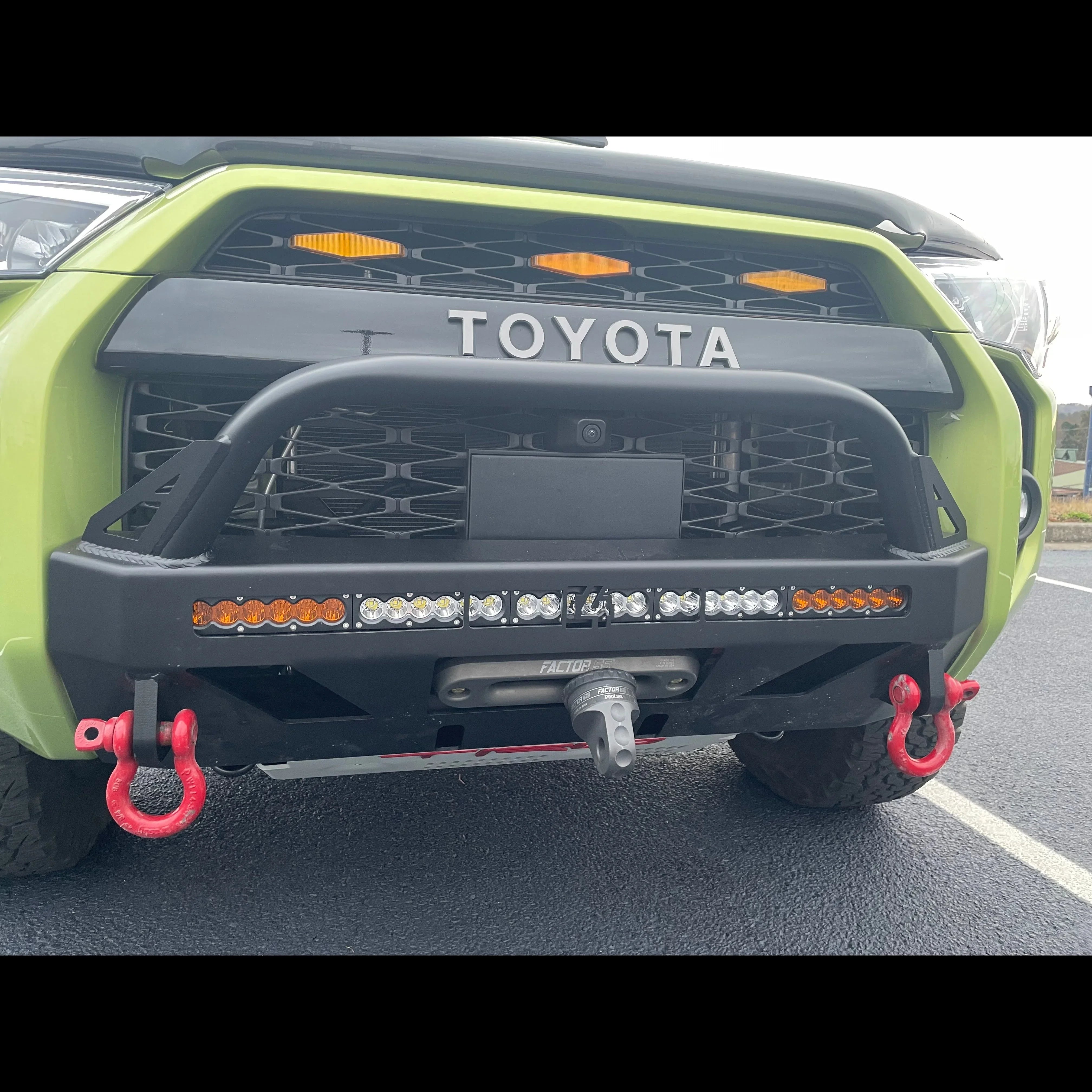 Toyota 4Runner front bumper with LED light bar, tow hooks, and off-road accessories