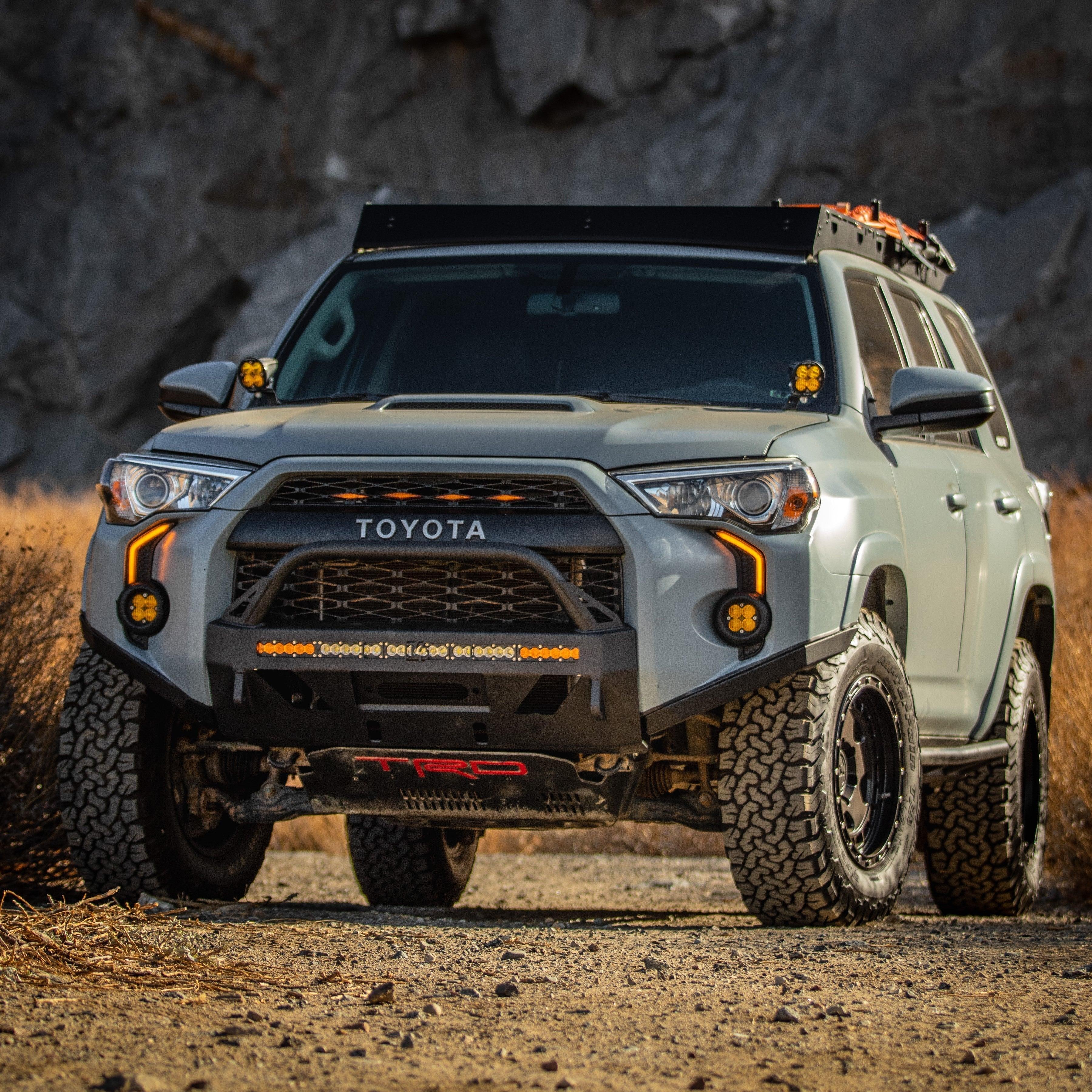 Lifted Toyota 4Runner with off-road accessories, custom bumper, LED lights and rugged tires outdoors