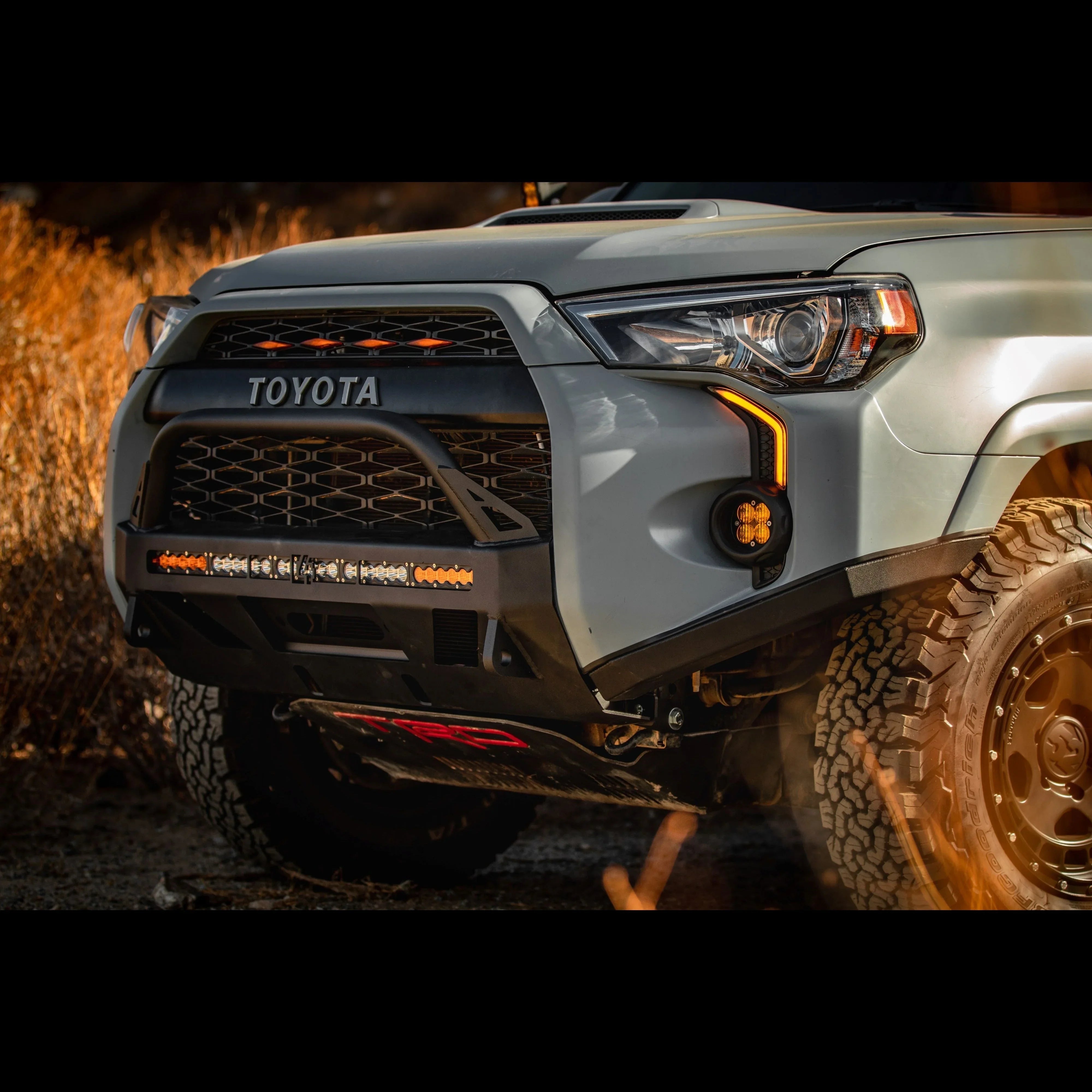 Toyota 4Runner front bumper with off-road LED lights and rugged all-terrain tires outdoors