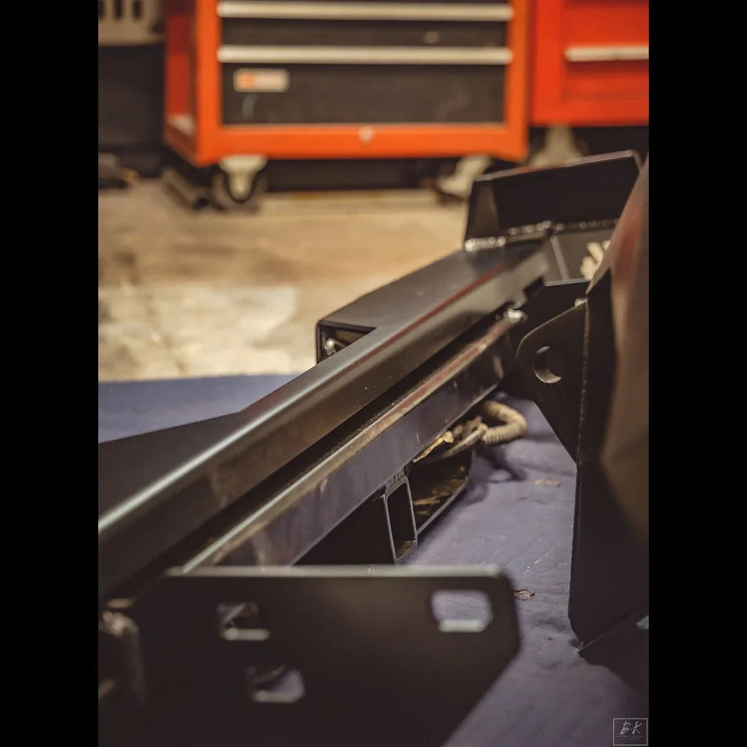 Steel overland rear bumper for 2nd Gen Toyota Tacoma in workshop setting