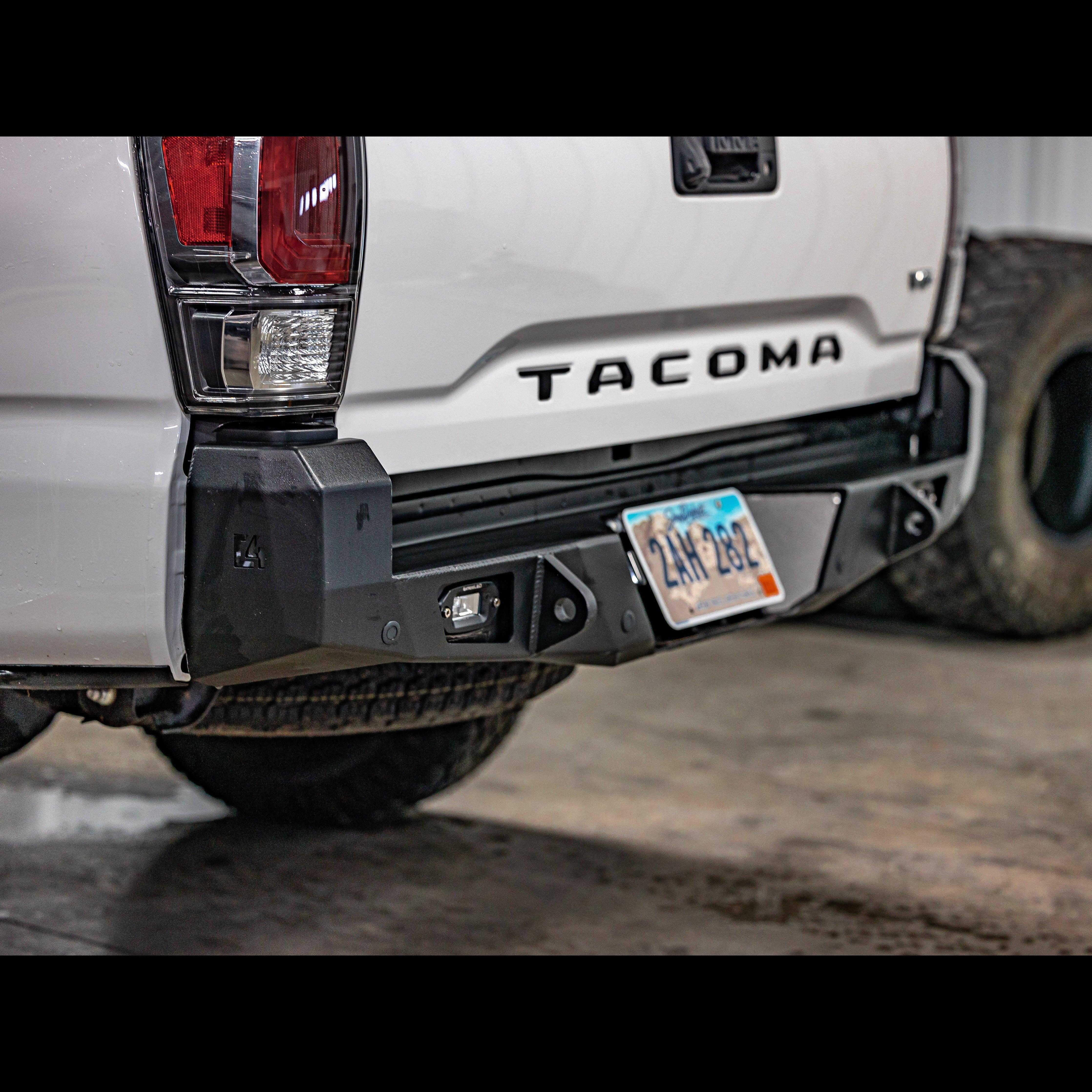 Tacoma 3rd Gen white truck with heavy-duty overland rear bumper and license plate