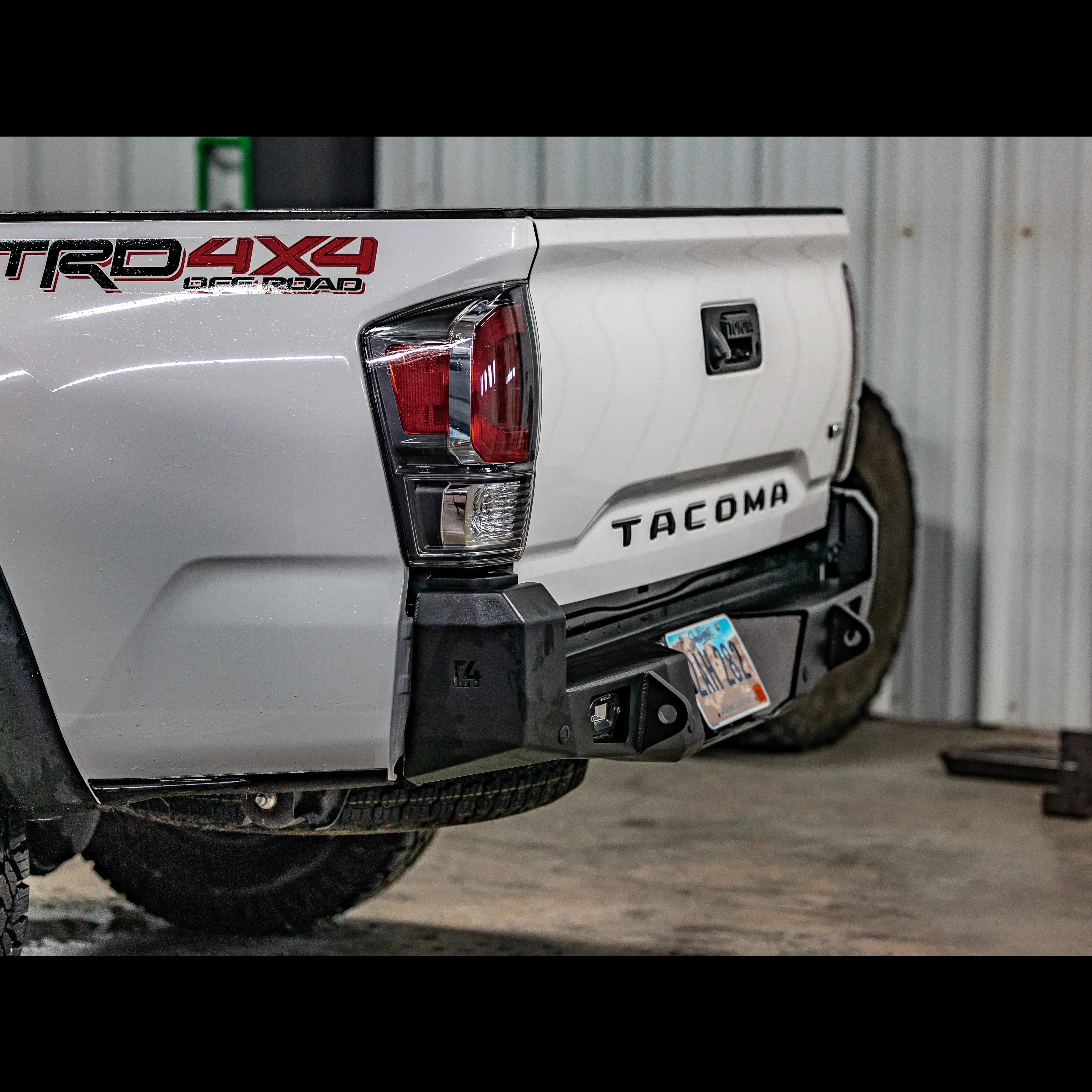Toyota Tacoma 3rd Gen rear overland bumper with TRD 4x4 Off Road decal in garage