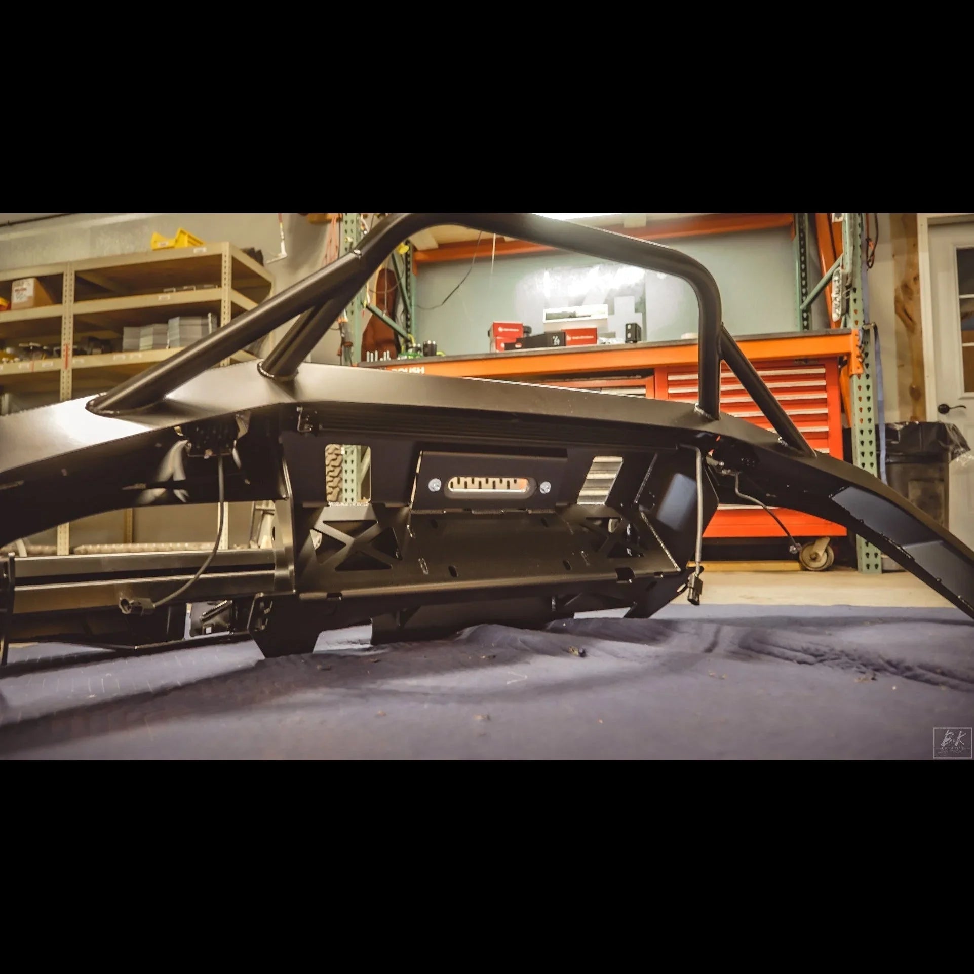 Steel overland front bumper for Toyota Tacoma 2005-2015 in garage workshop
