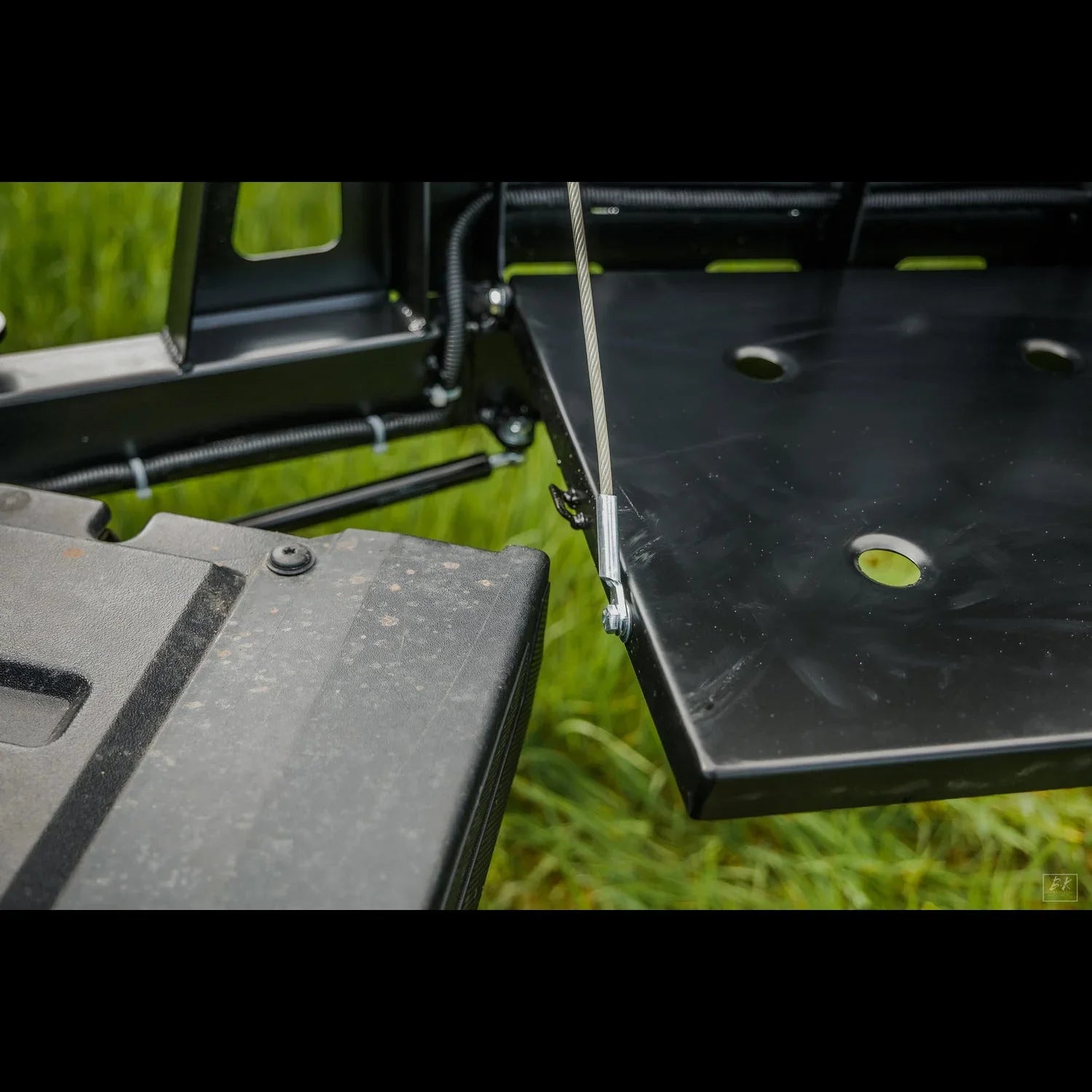 High clearance rear bumper swing out for Toyota Tacoma 3rd Gen, shown open over grass