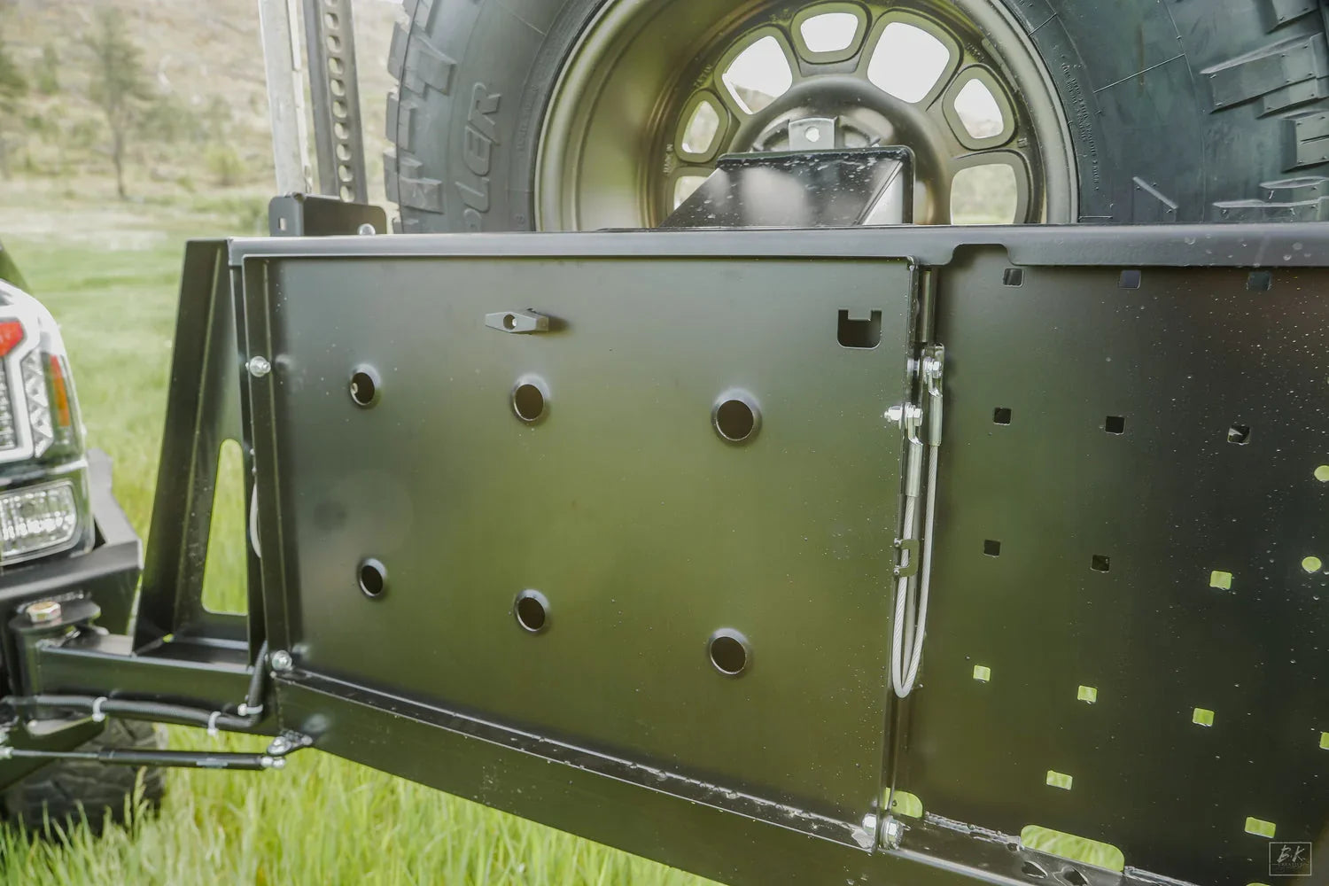 High clearance rear bumper with spare tire mount for Toyota Tacoma overland vehicle